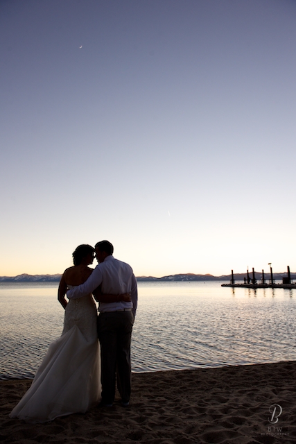 bride and groom share a sunset on Lake Tahoe on their wedding day.  