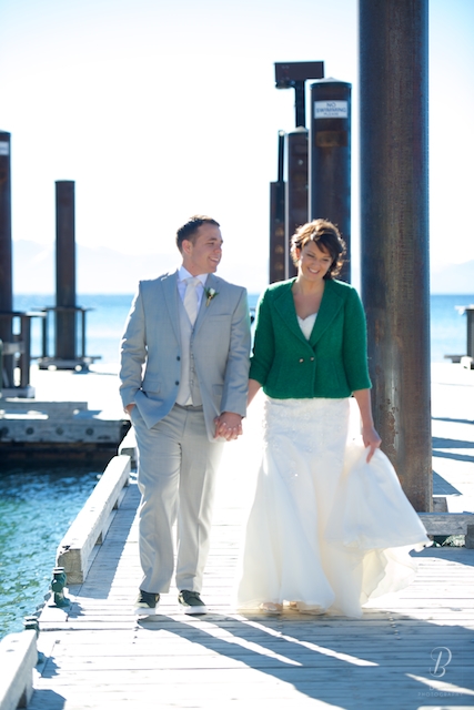 Bride and groom walk the pier at  Lake Tahoe Hyatt