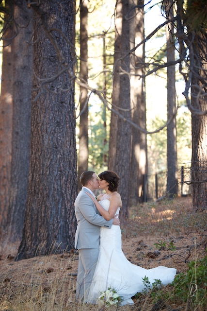 bride and groom kissing in the woods near Lake Tahoe