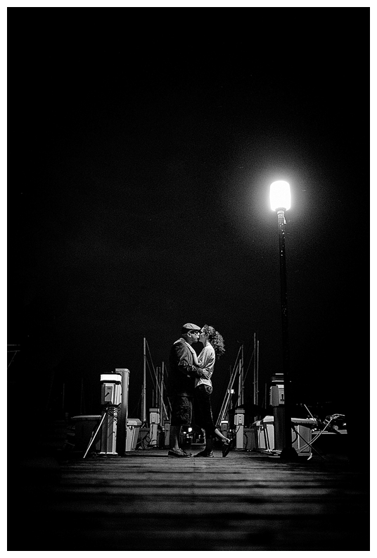 Nighttime dockside kiss to end the engagement session
