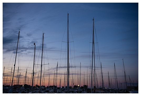 Engagement session sunset over sailboats