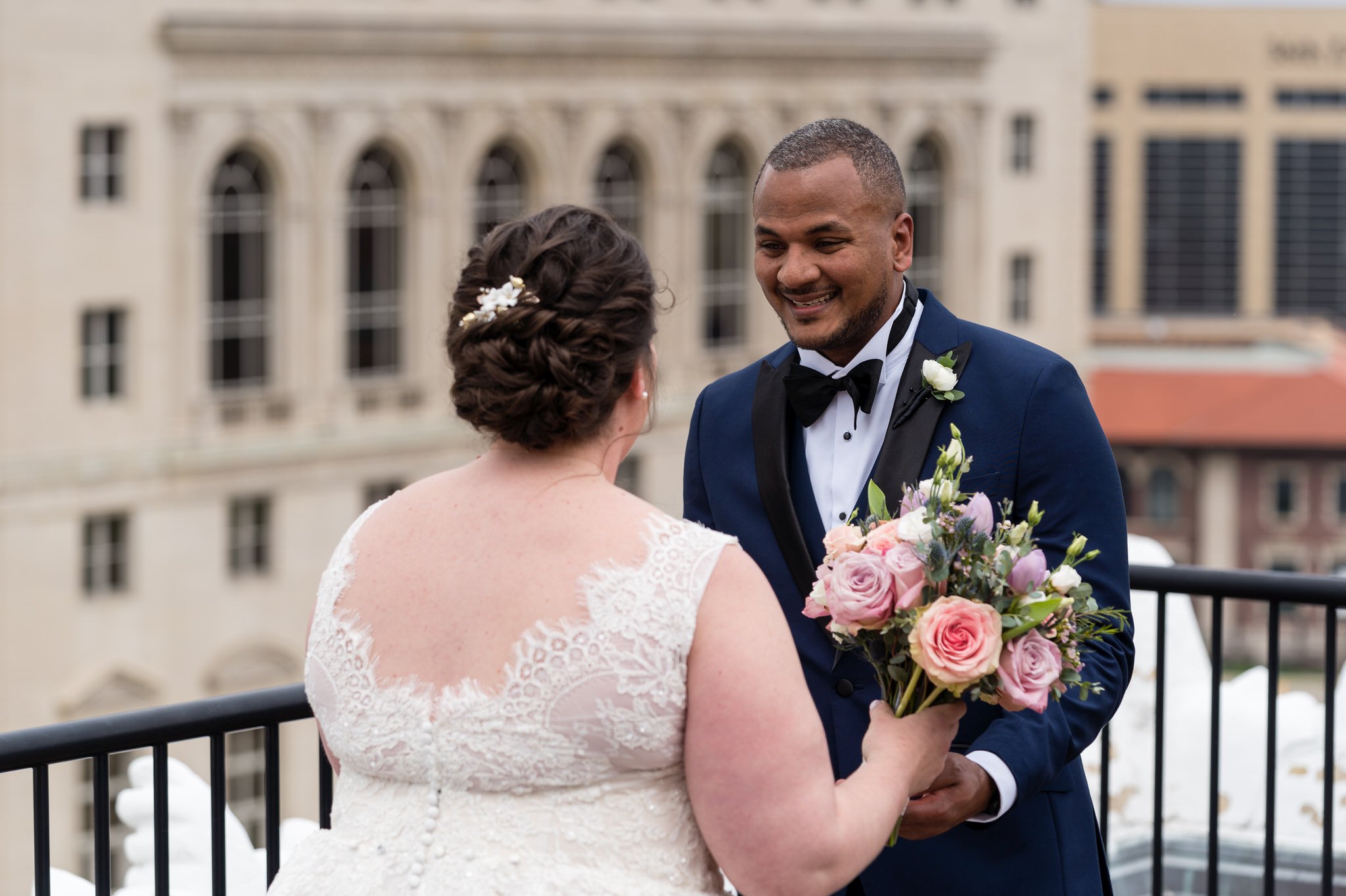 a groom reacts to seeing his bride for the first time