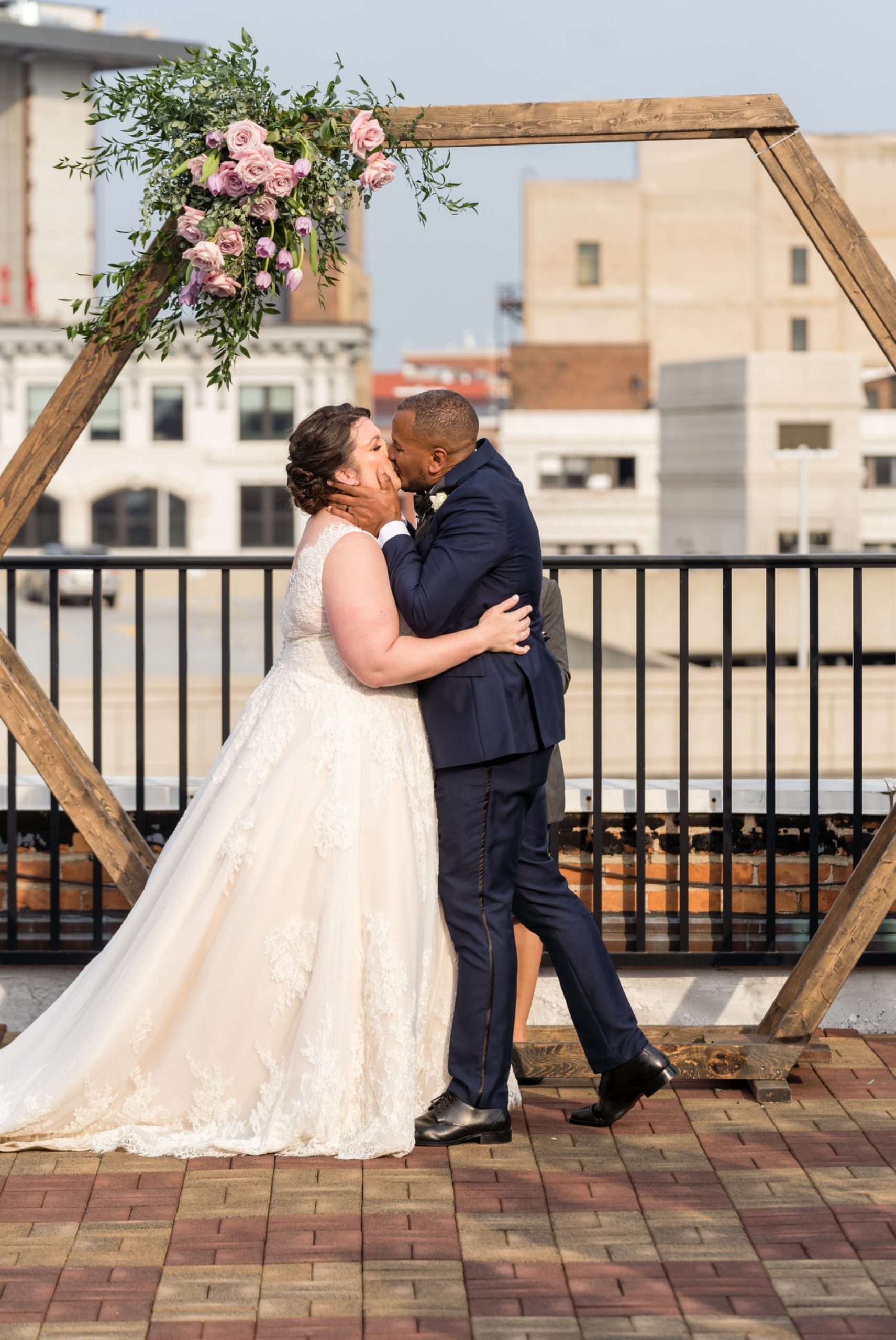 bride and groom share a first kiss at their wedding at the Detroit Opera house