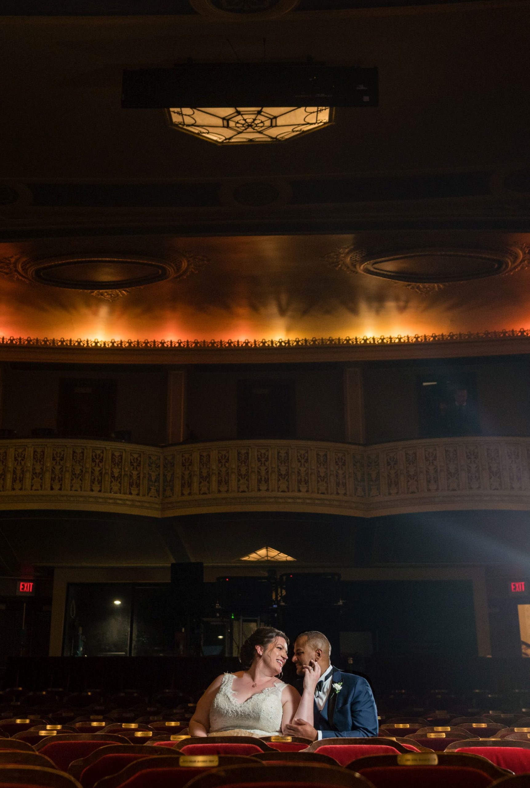 a bride and groom sit in the Detroit Opera house theatre