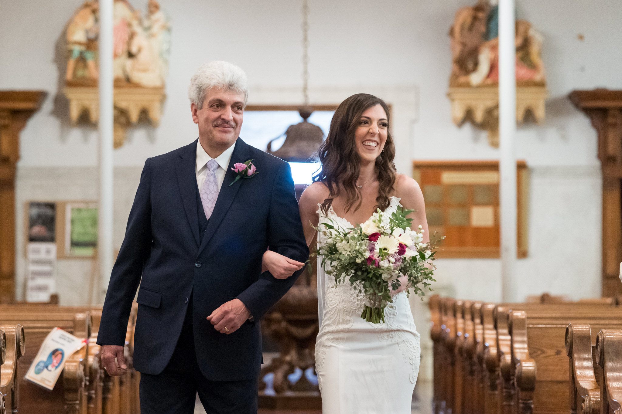 bride and her father walking down the aisle at Saints Peter and Paul Jesuit church in Detroit, MI