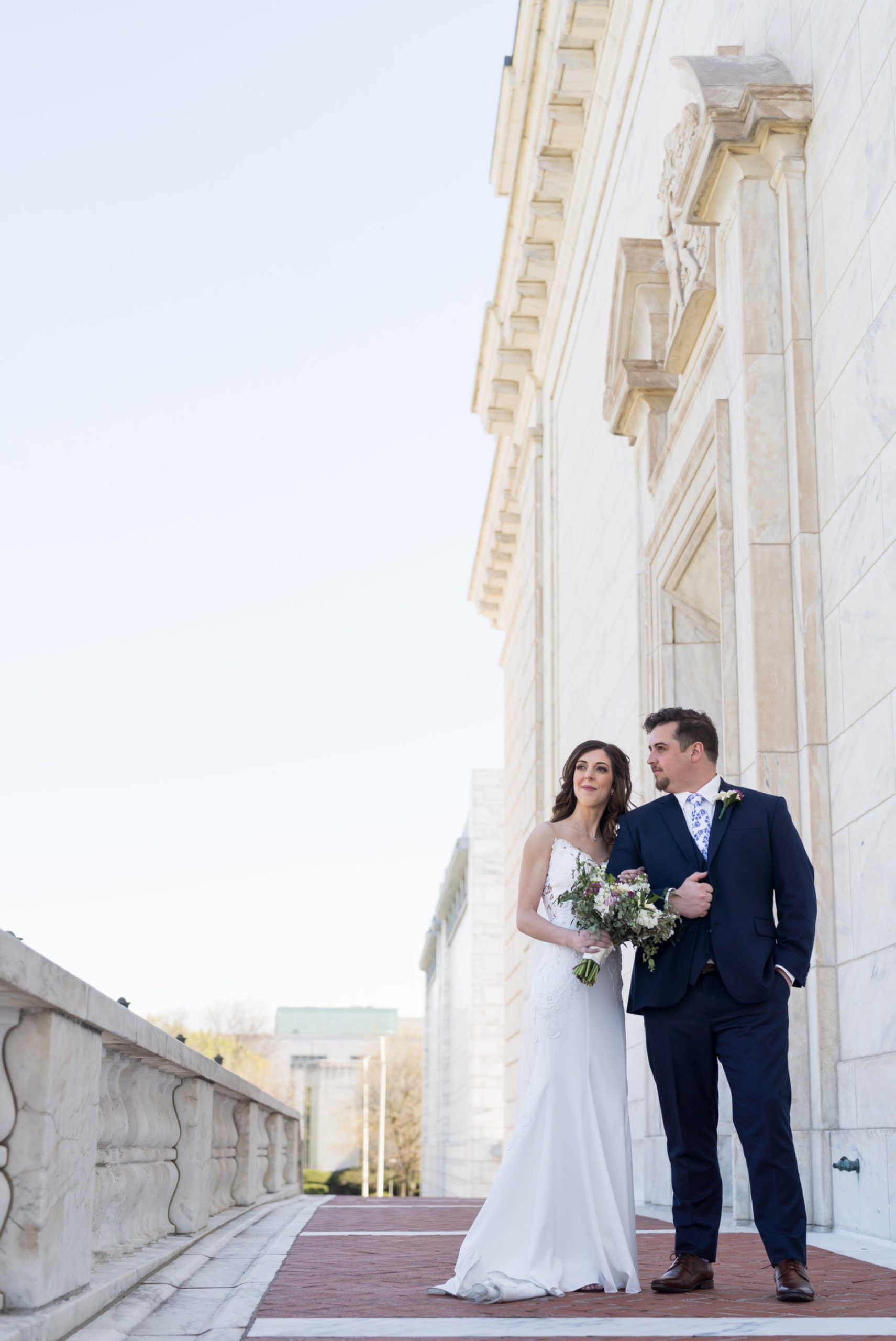 bride and groom looking out at the skyline at the Detroit Institute of Arts