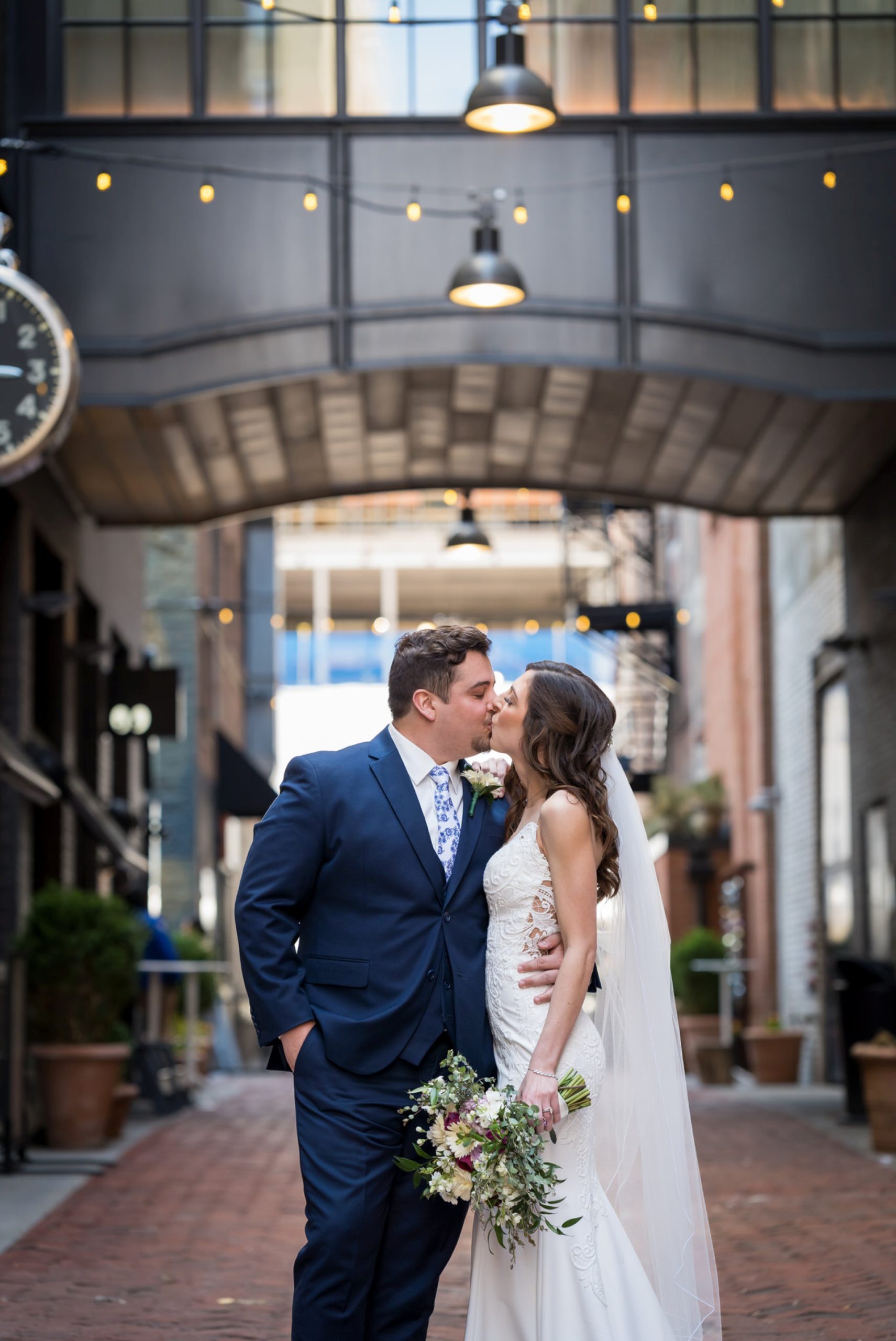 bride and groom share a kiss in Parker's Alley Detroit