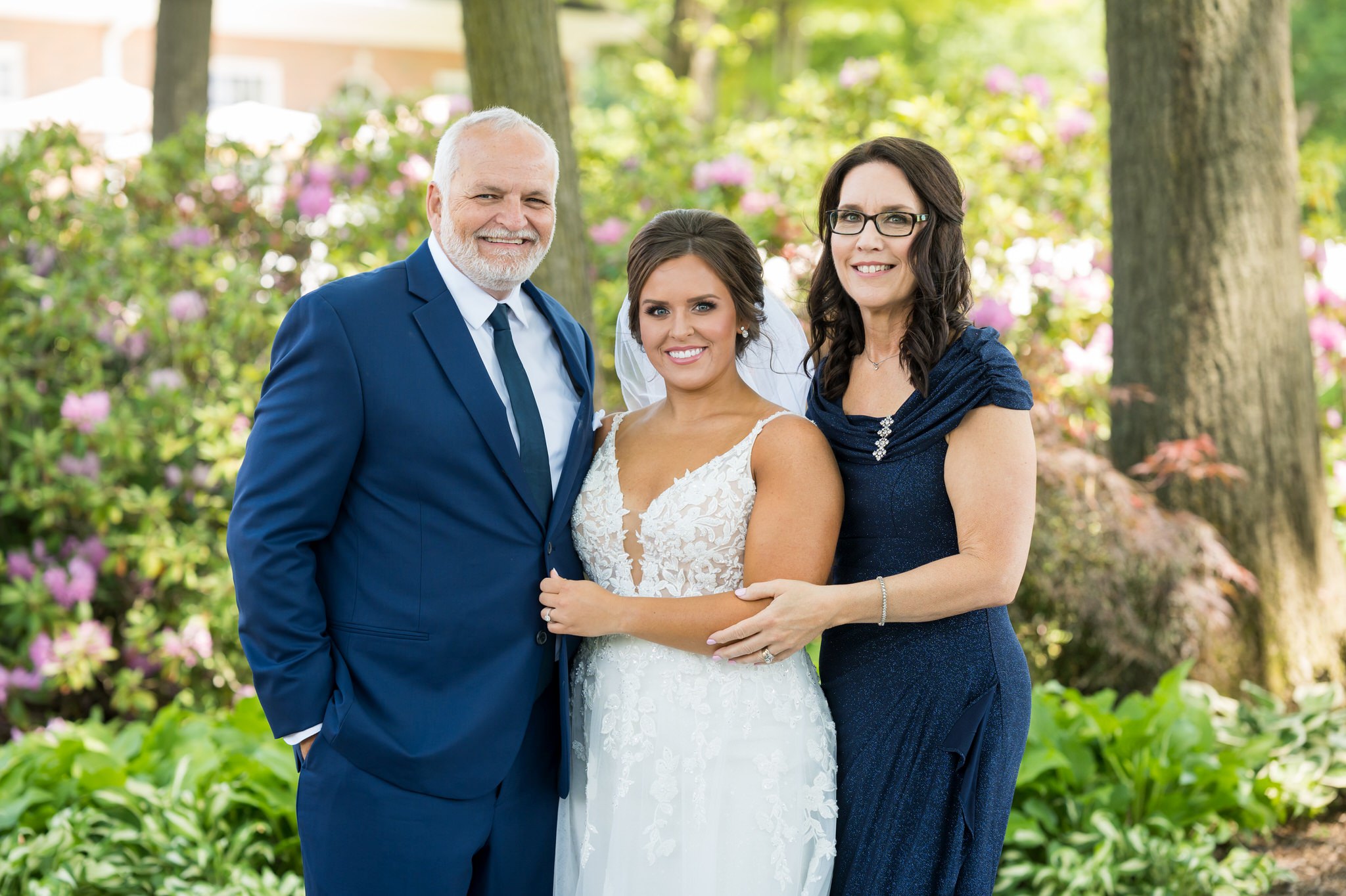 a family portrait with a bride at a wedding at Cherry Creek Golf Club