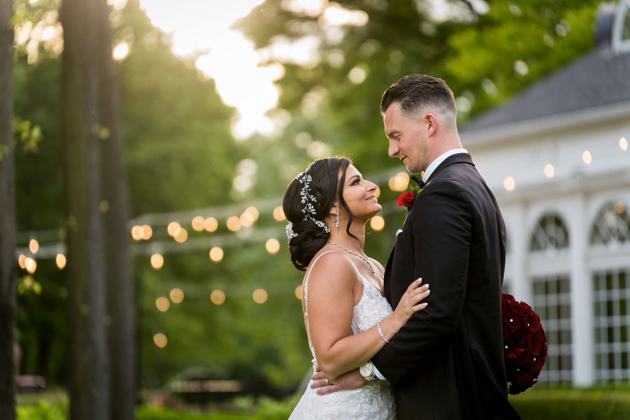 a bride and groom embrace and look at each other during the golden hour at their Cherry Creek Golf Club wedding