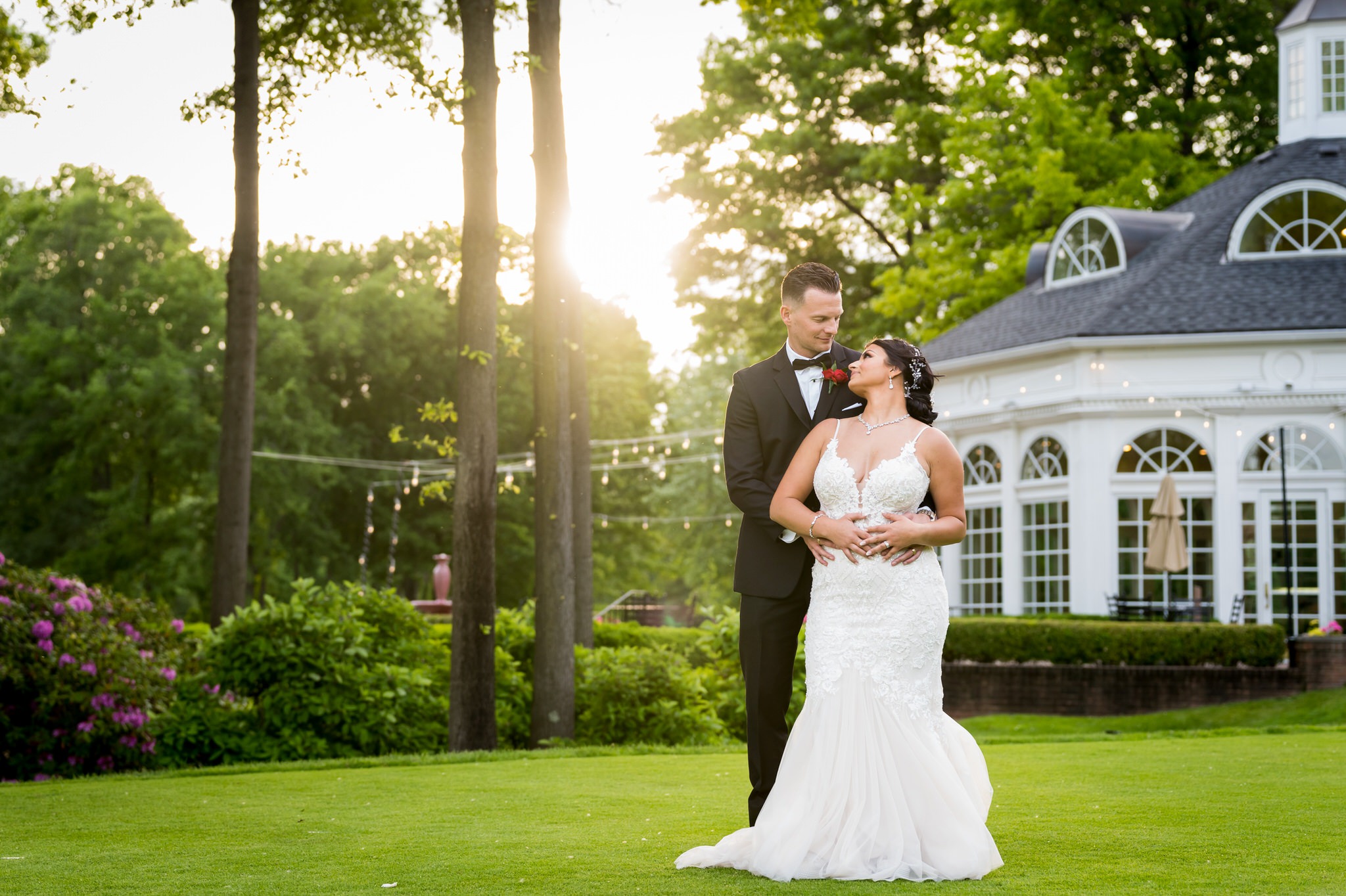 bride and groom embrace during the golden hour at their Cherry Creek Golf Club wedding