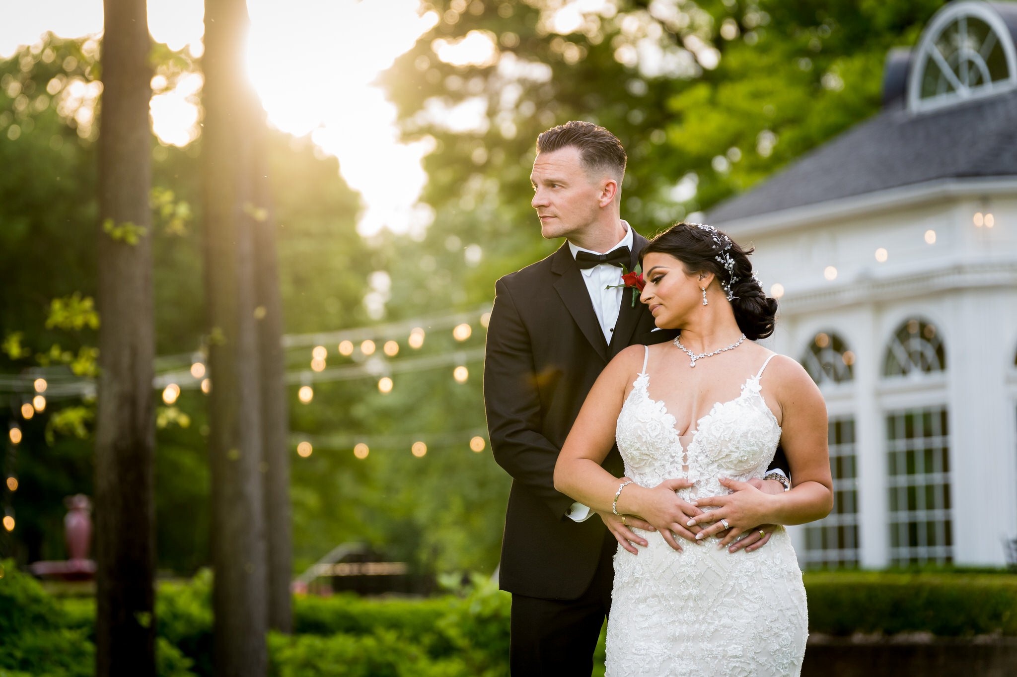 bride and groom embrace during the golden hour at their Cherry Creek Golf Club wedding