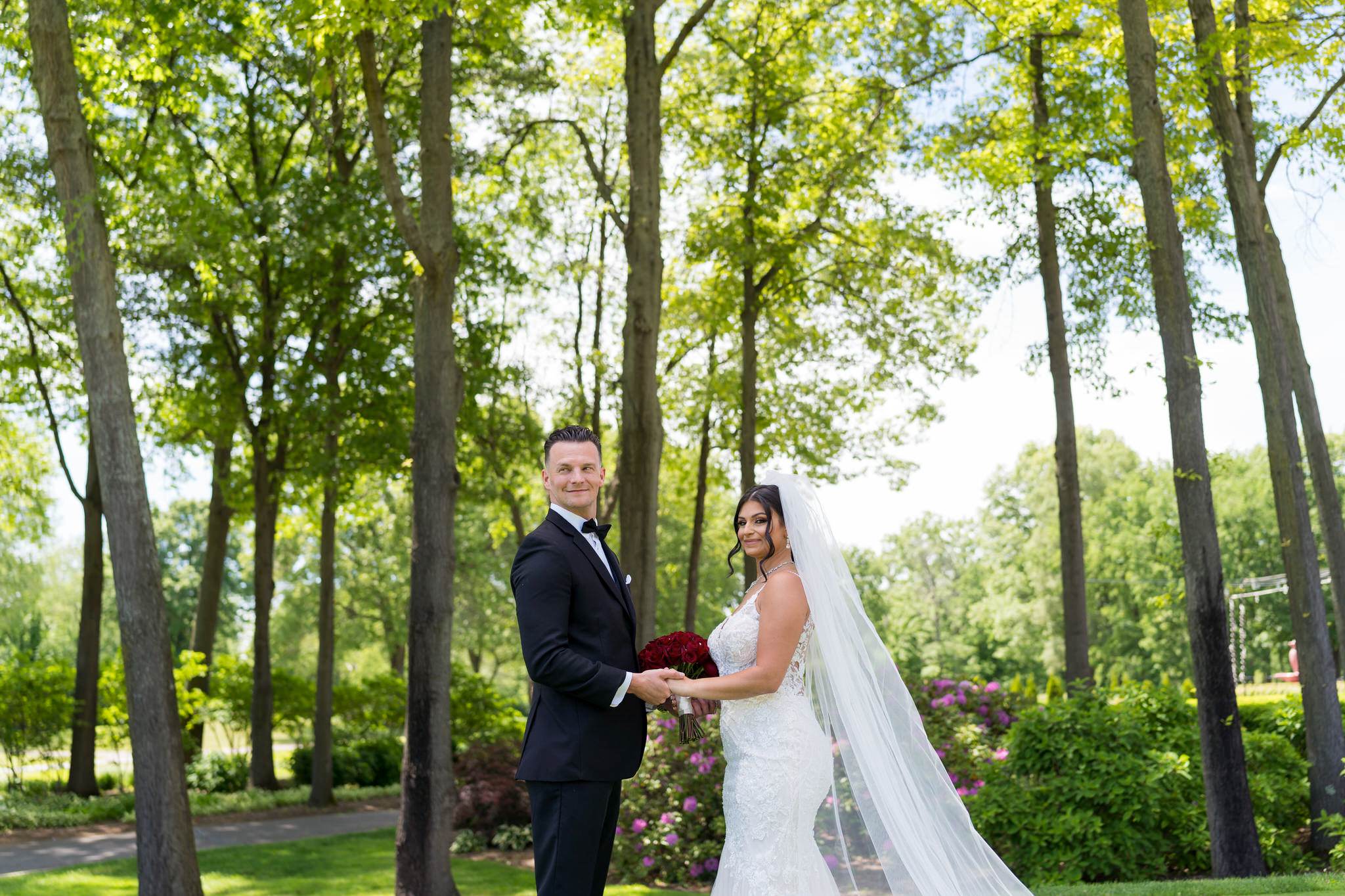 a bride and groom hold hands at their Cherry creek Golf Club wedding