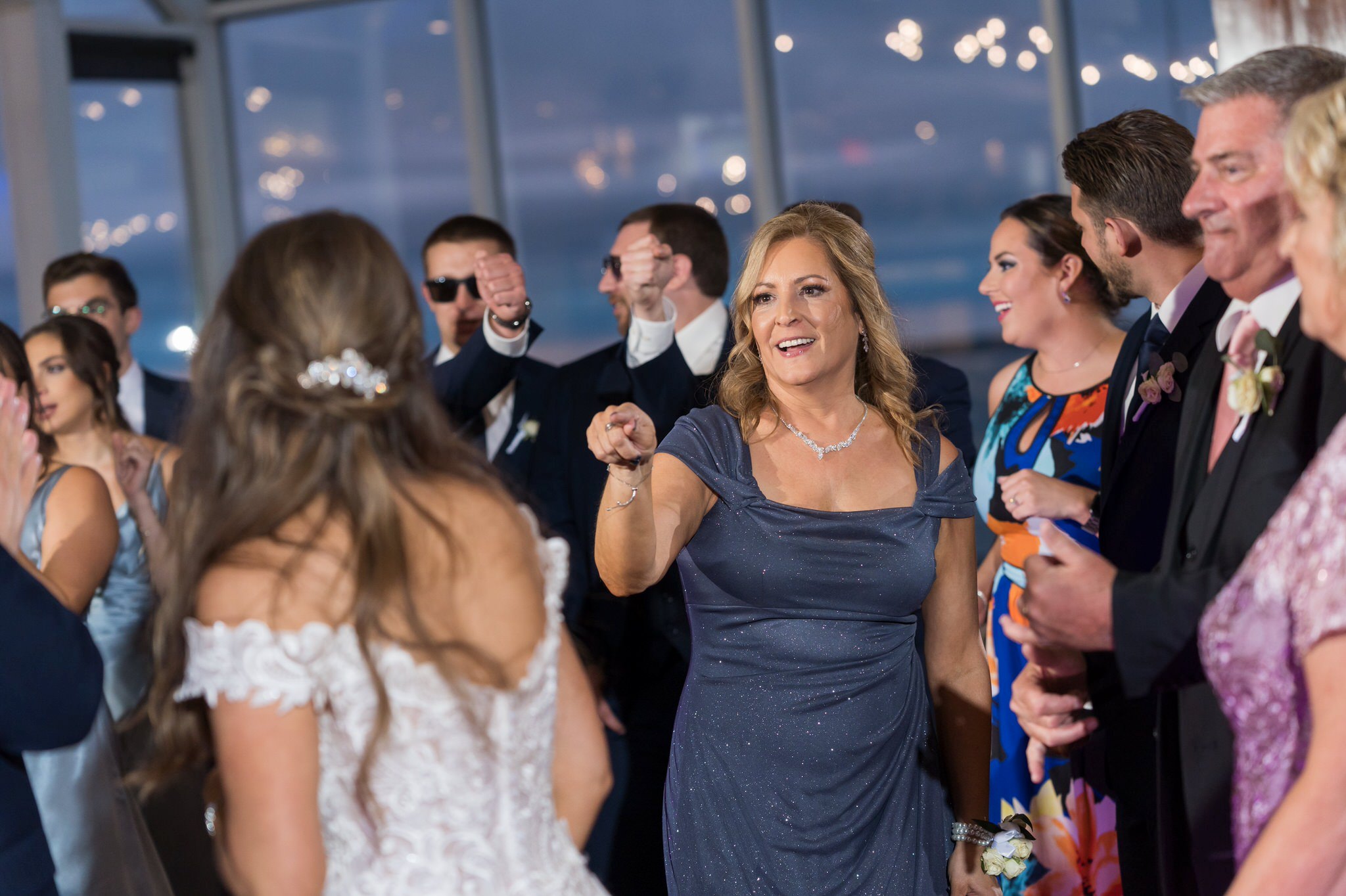 Mother of bride dancing at MacRay Harbor wedding reception
