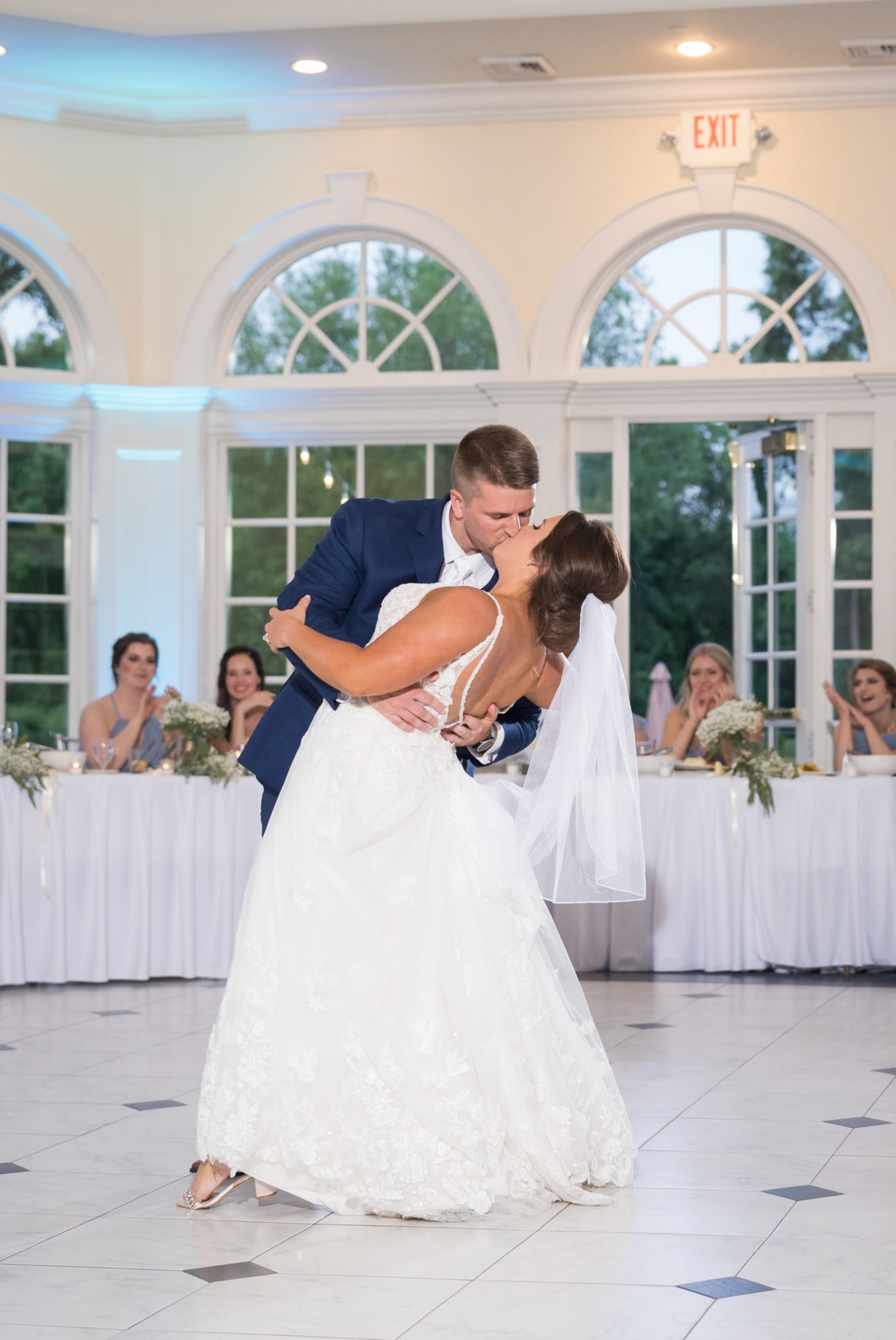bride and groom  kiss after their first dance at a wedding at Cherry Creek Golf Course 