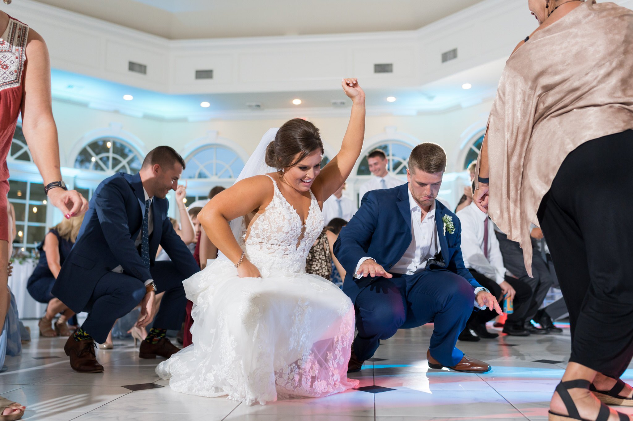 bride and groom dance close to the floor at their wedding at Cherry Creek Golf Course