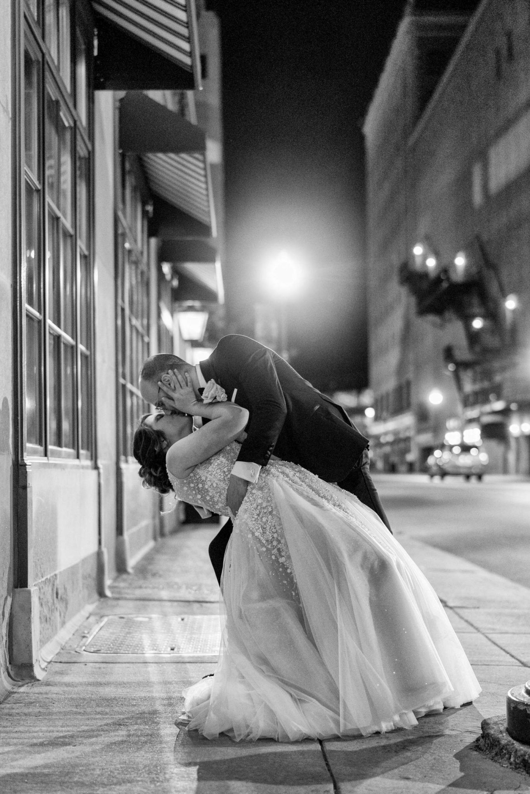 kiss at the end of the night during their Colony Club wedding 