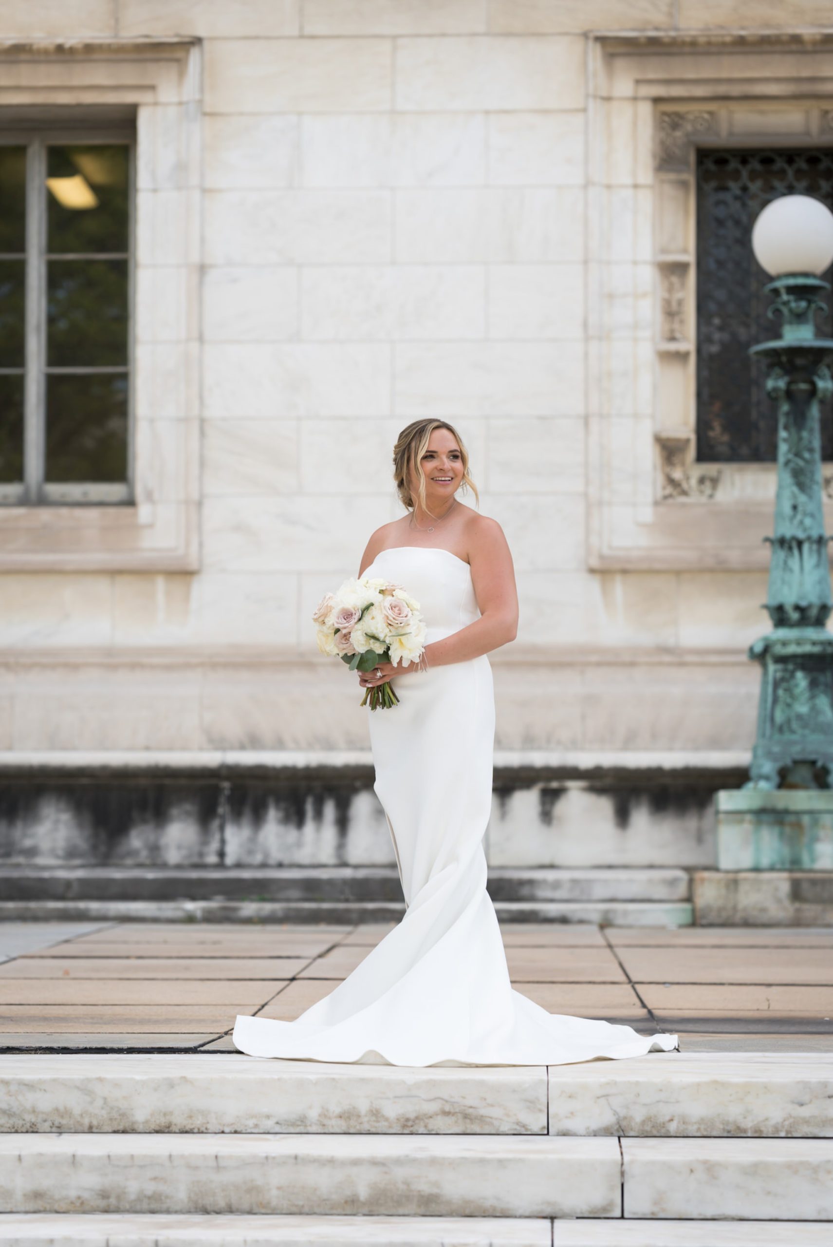 bride holds a bouquet detroit public library wedding 