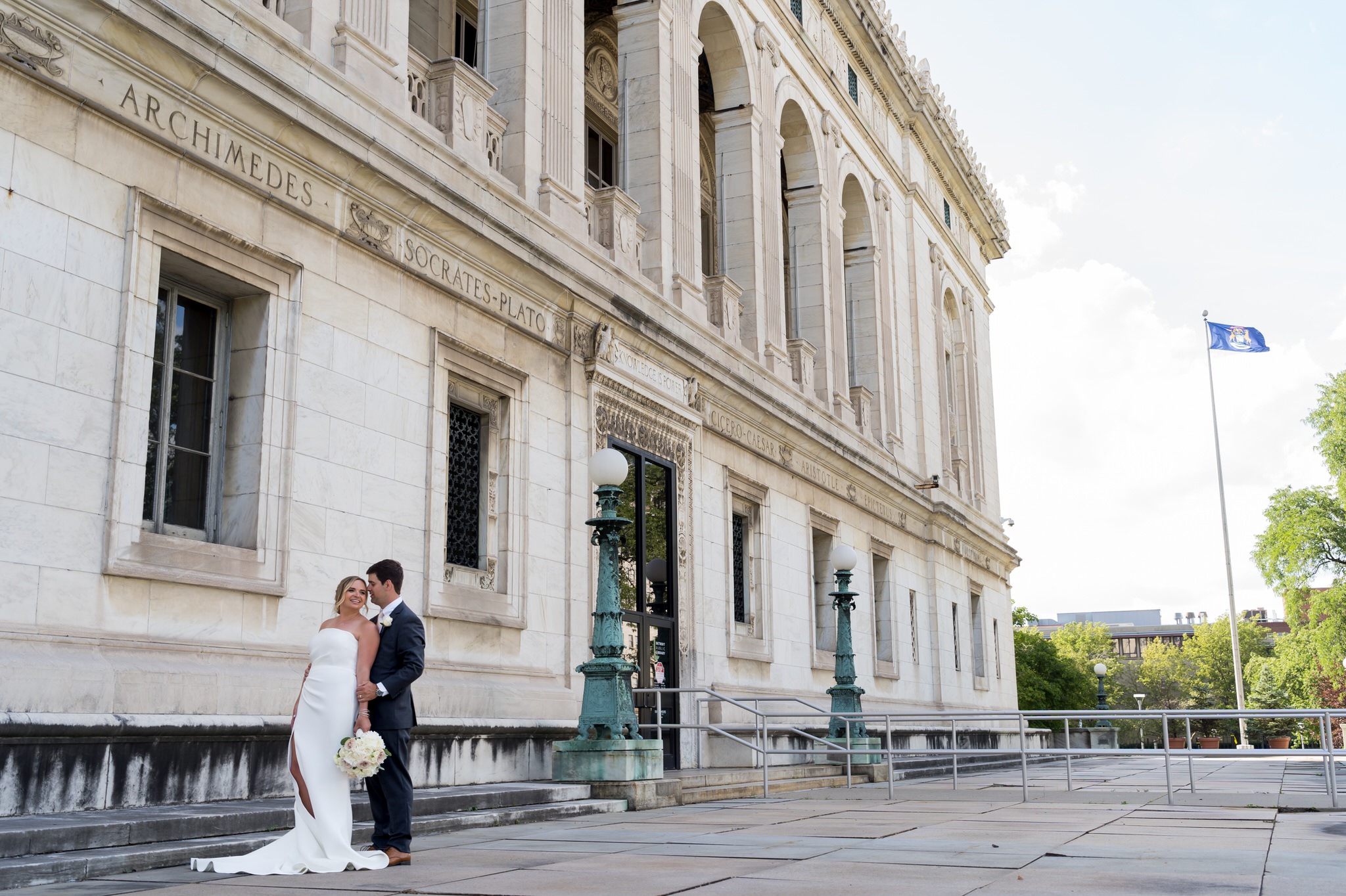 bride and groom kiss at the Detroit Public Library