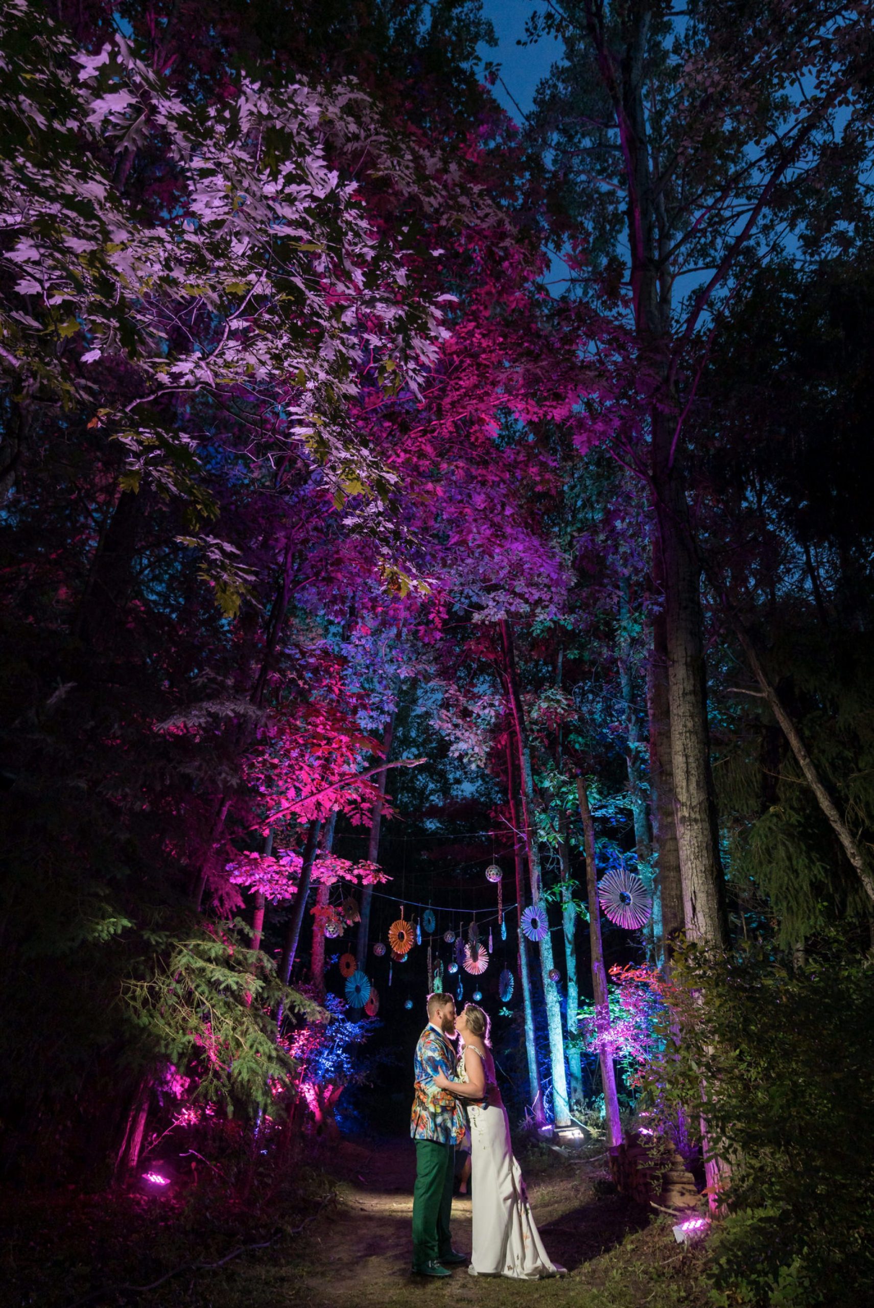 bride and groom kiss at Electric Forest wedding