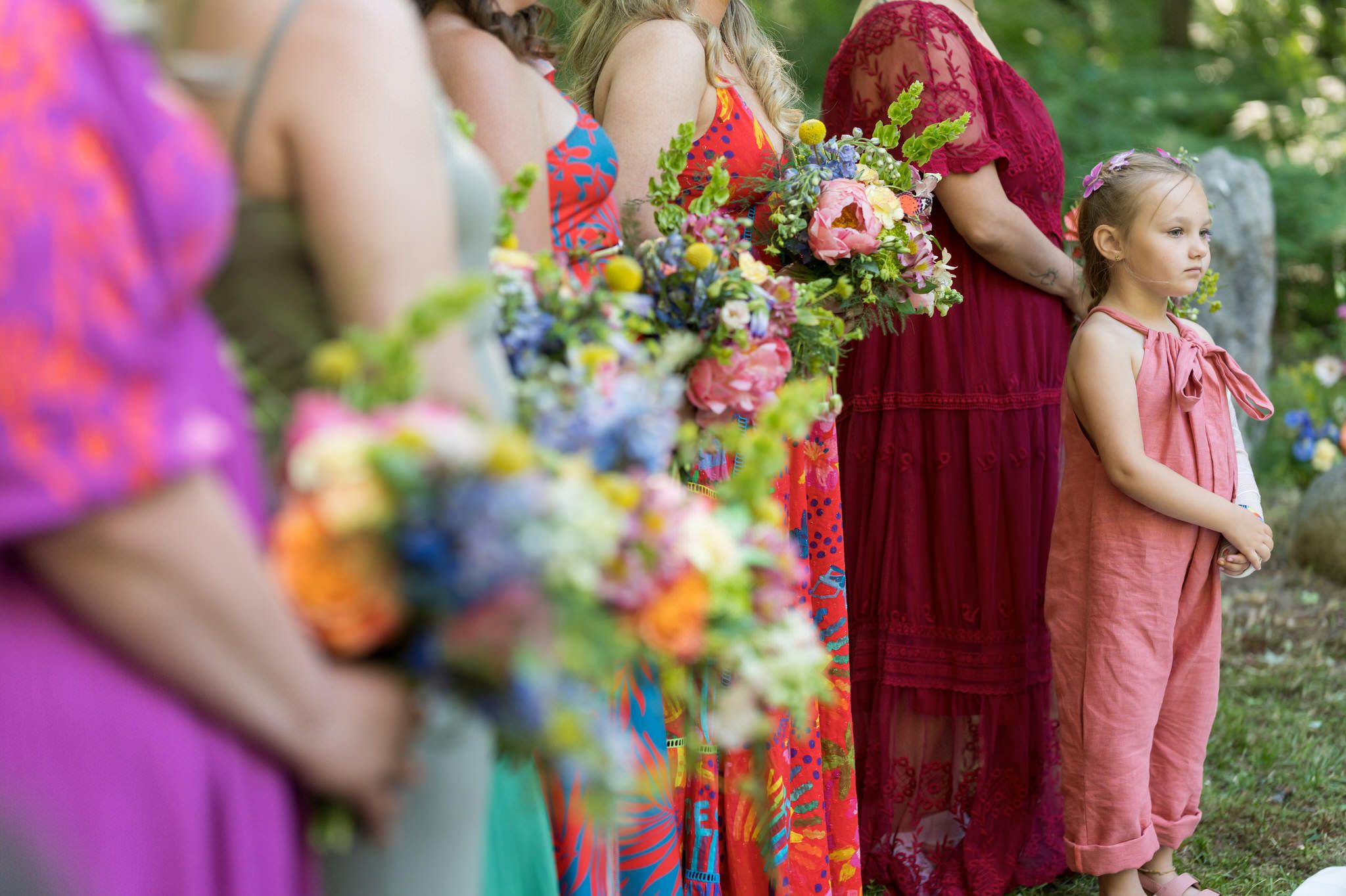 flower girl surrounded by bouquets