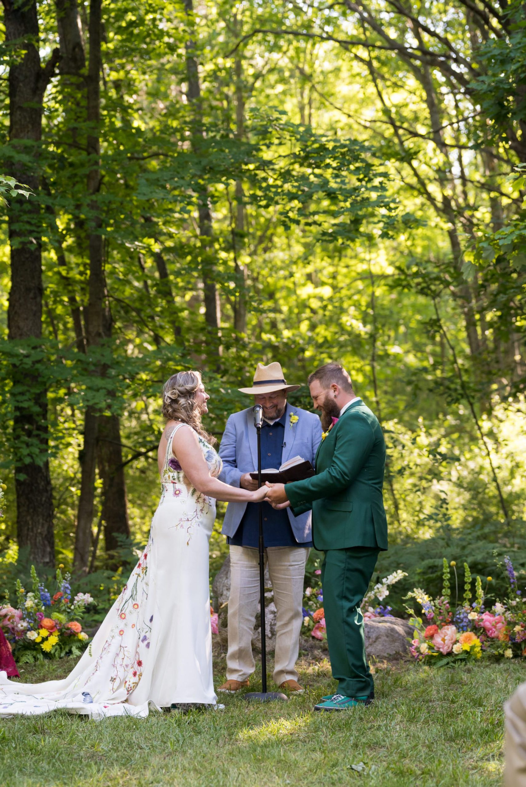 bride and groom exchange vows at their Electric Forest wedding ceremony