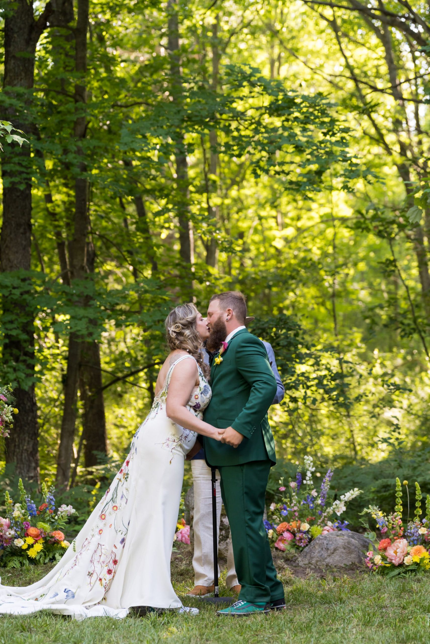 bride and groom kiss at their Electric Forest wedding ceremony