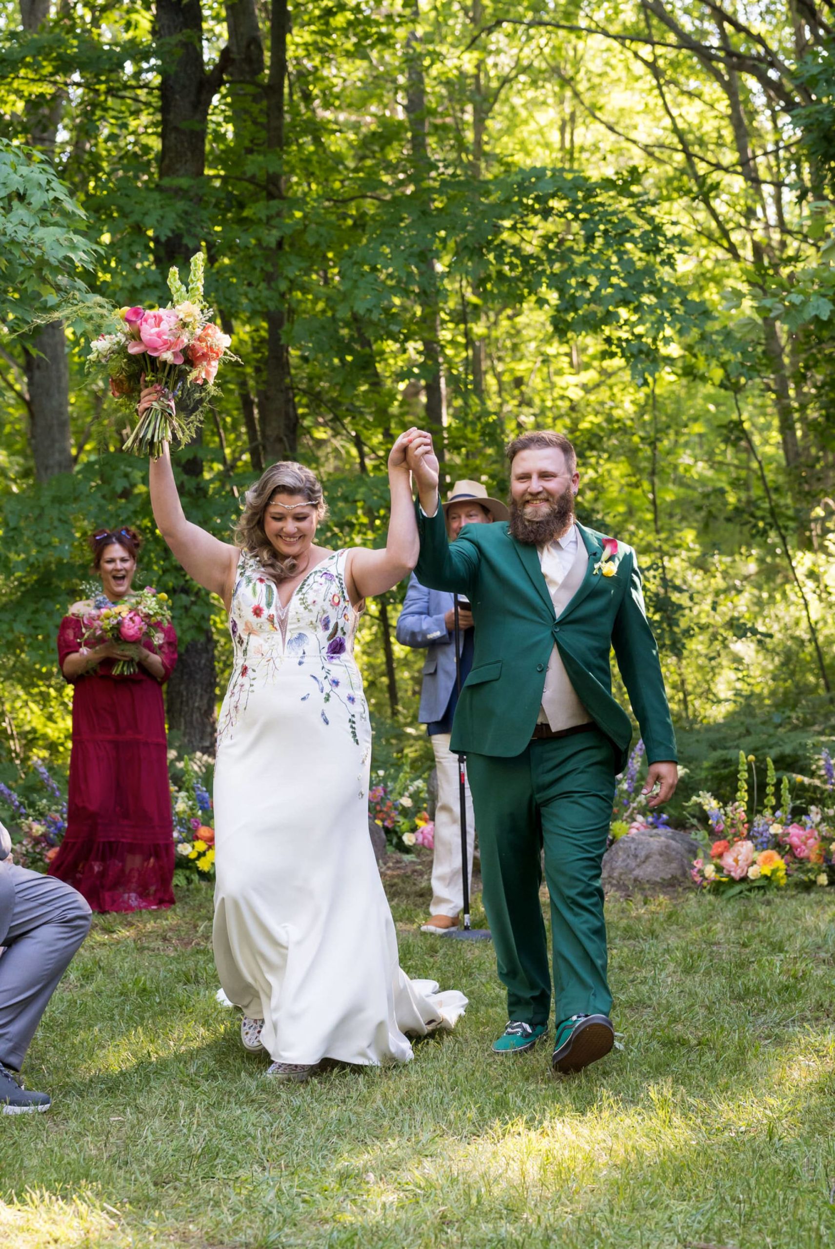 bride and groom celebrate at their Electric Forest wedding ceremony