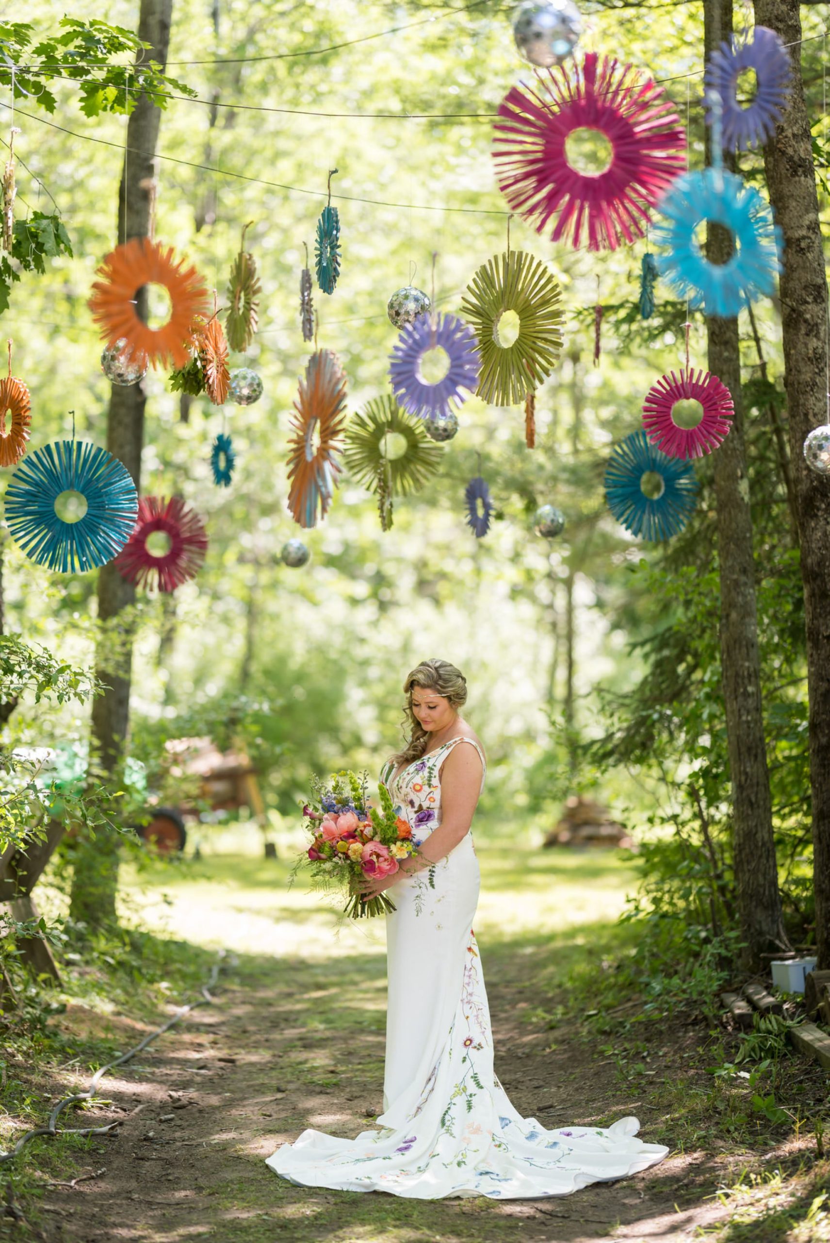 bride holds bouquet at her Electric Forest wedding