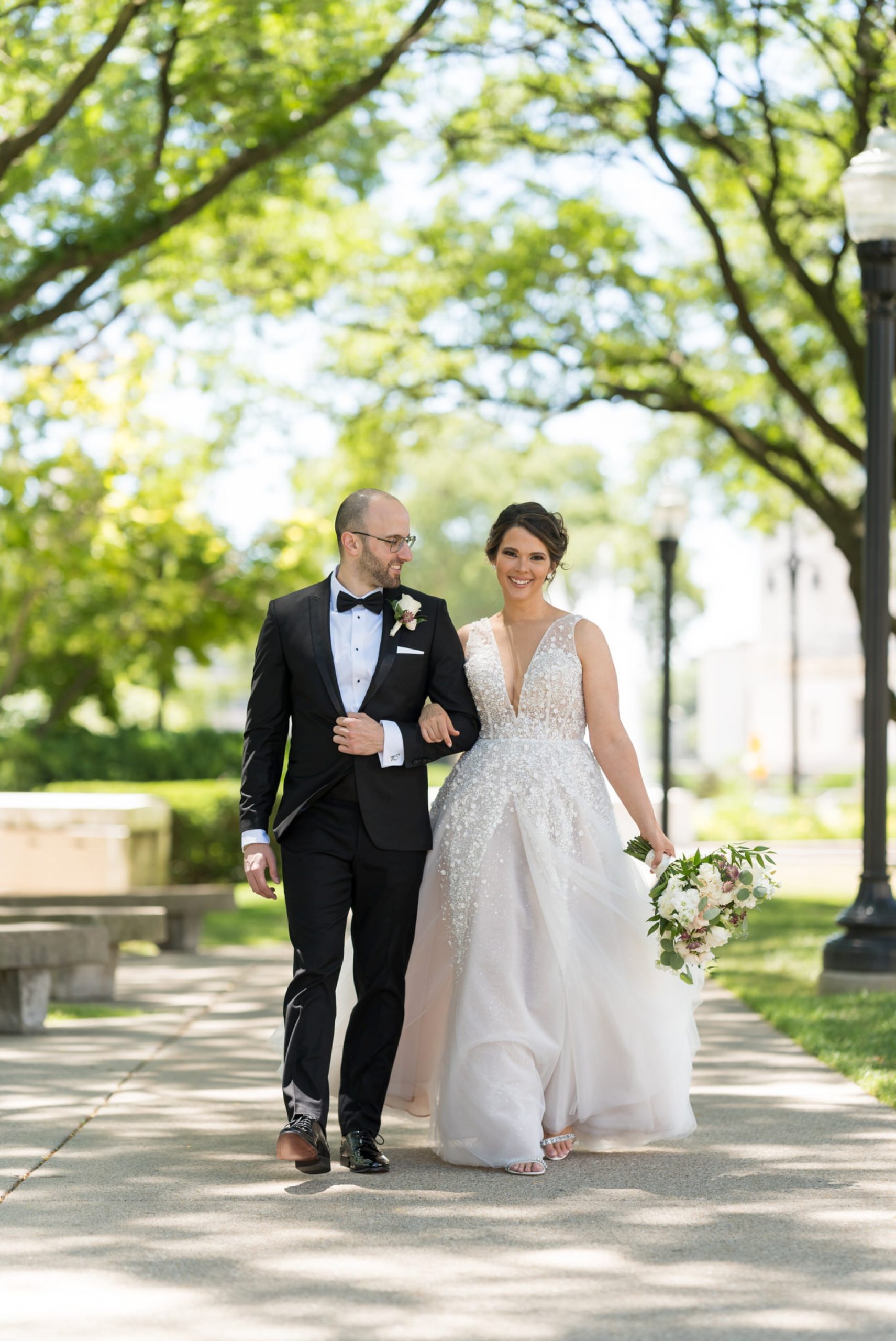 bride and groom walk together at DIA