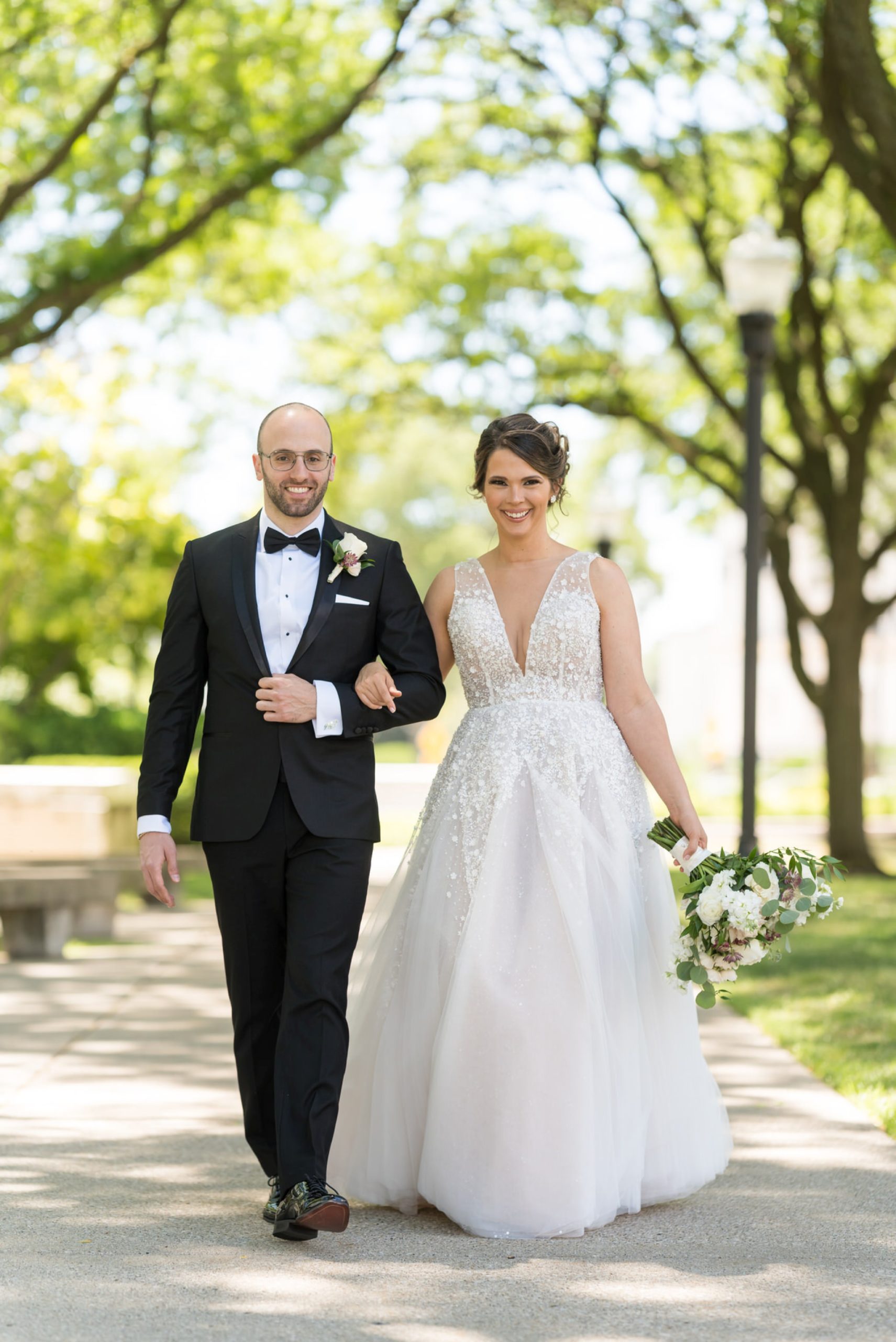 bride and groom walk together at DIA