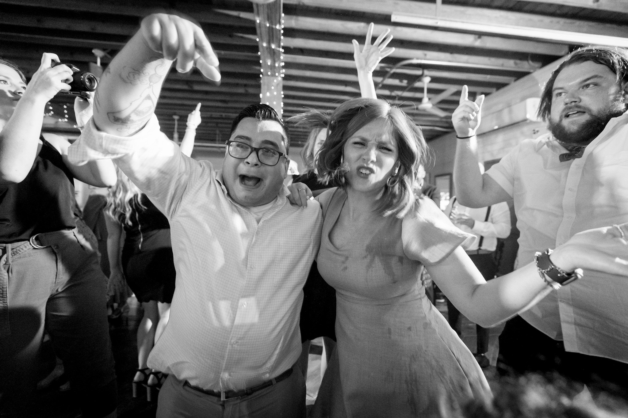 guests dance and point at a Holly Vault wedding reception