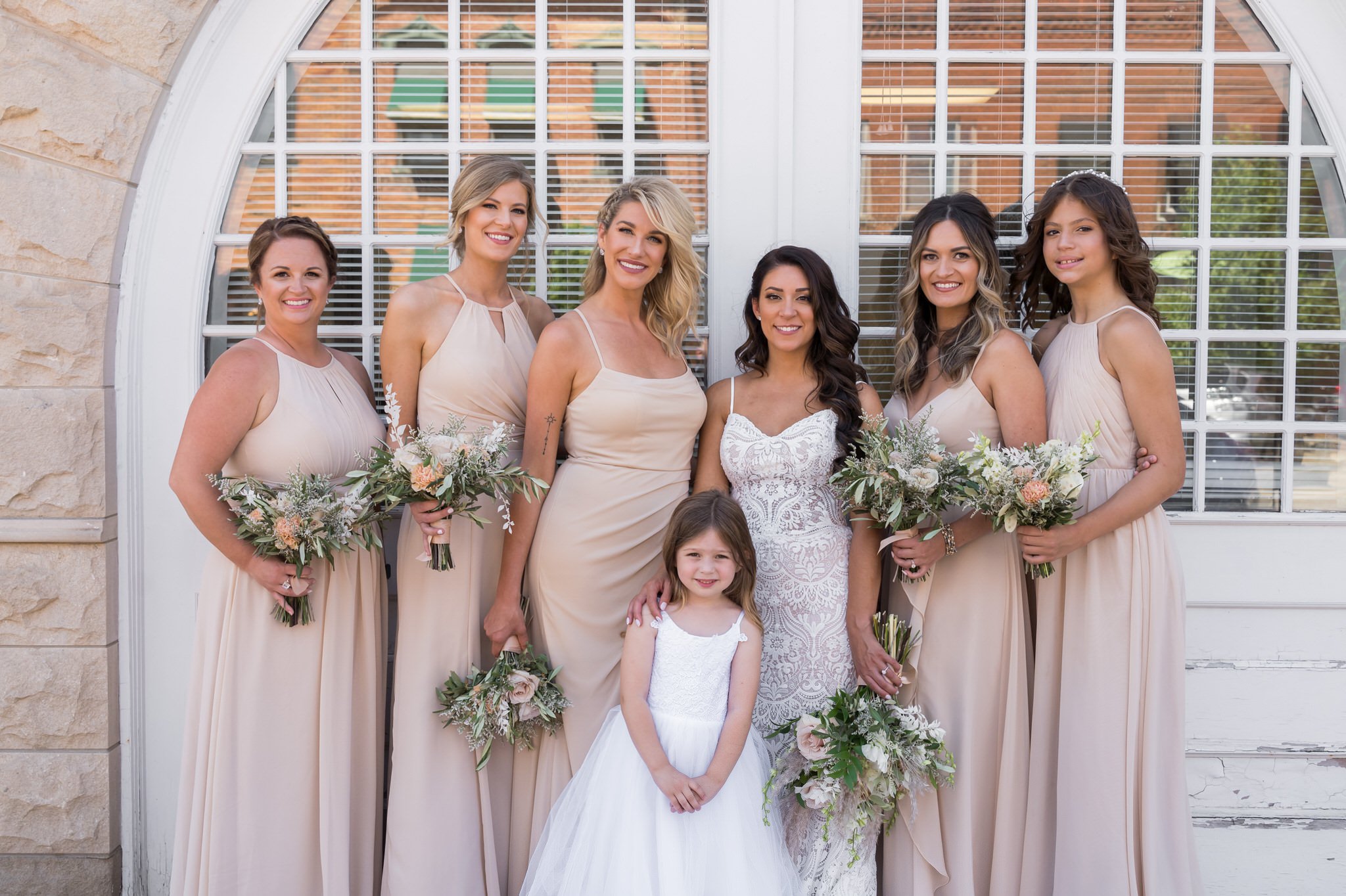 bride and her bridesmaids in downtown Holly, MI