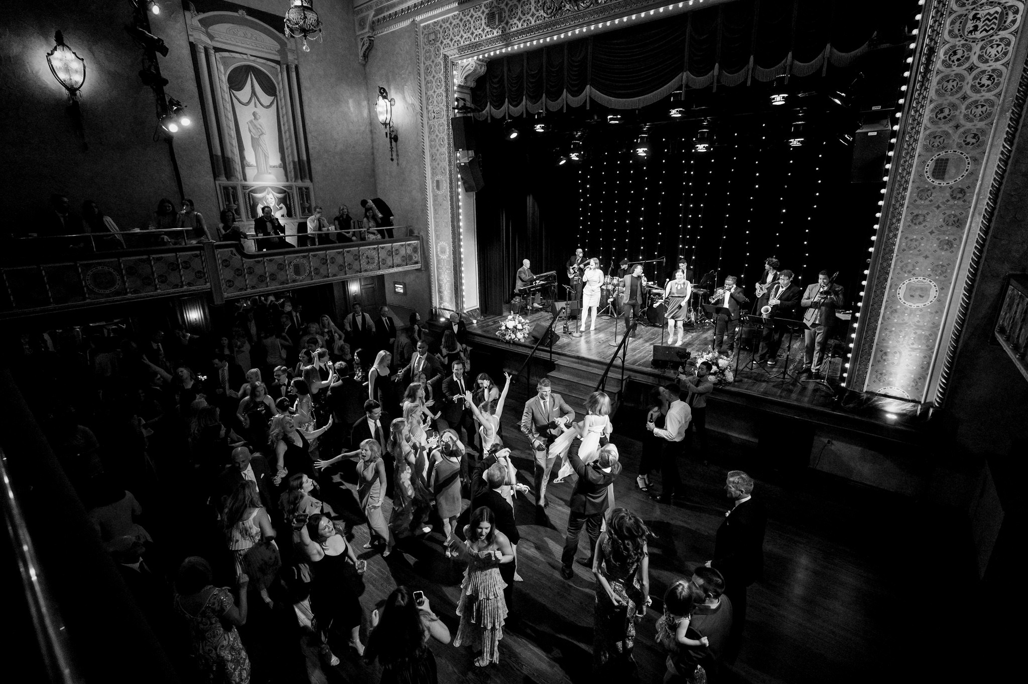 A wide-angle photo from the balcony showing a full dance floor at a Gem Theatre Detroit wedding.