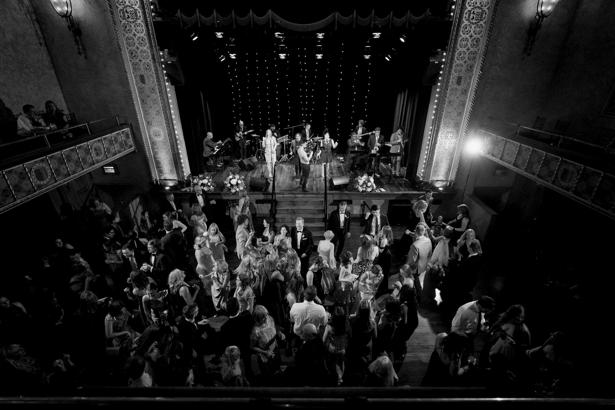 A shot from the balcony of a crowded dance floor at a Gem theatre Detroit wedding .