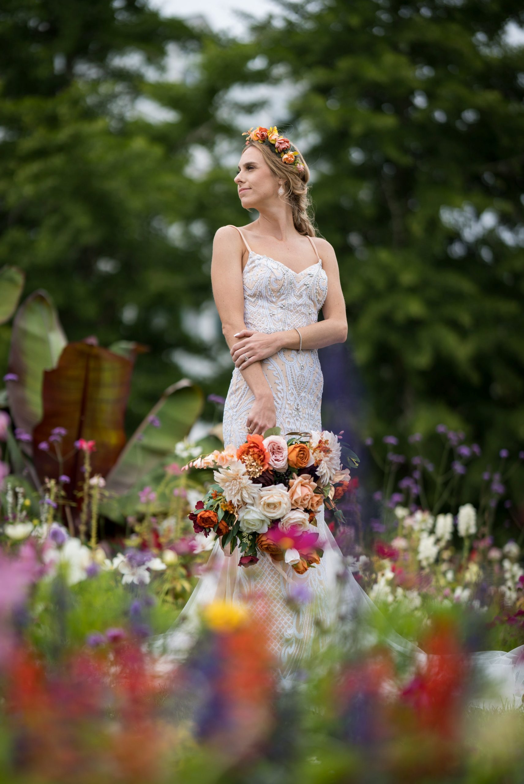 A bride poses with her bouquet in the gardens of the Grand Hotel on Mackinac Island.   