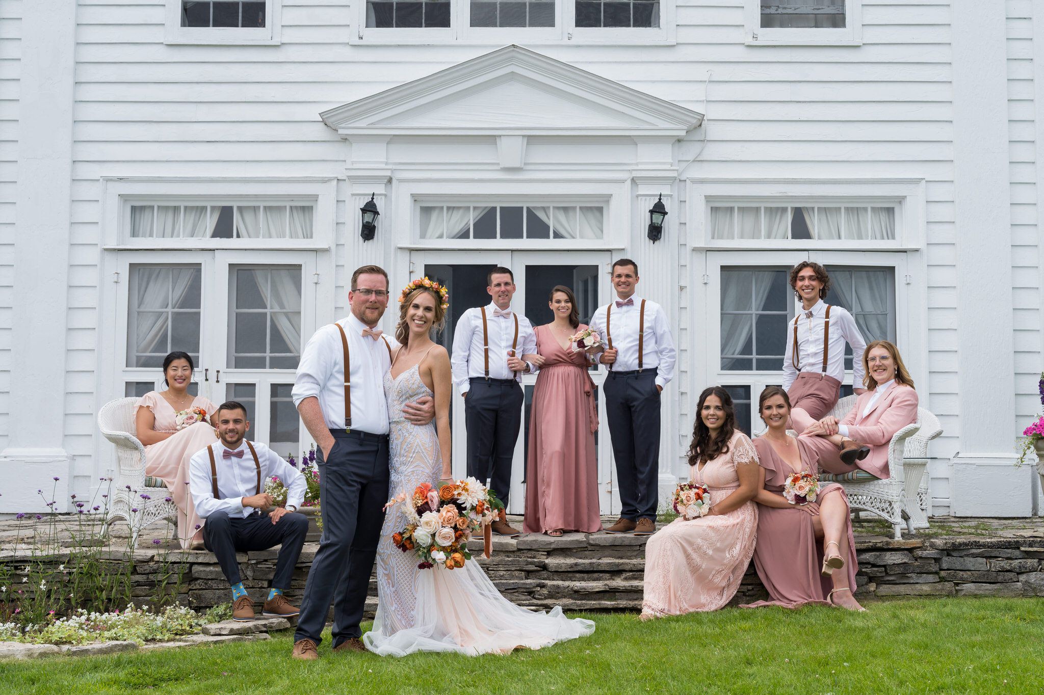 A bridal party poses at Mission Point Resort wedding on Mackinac Island.