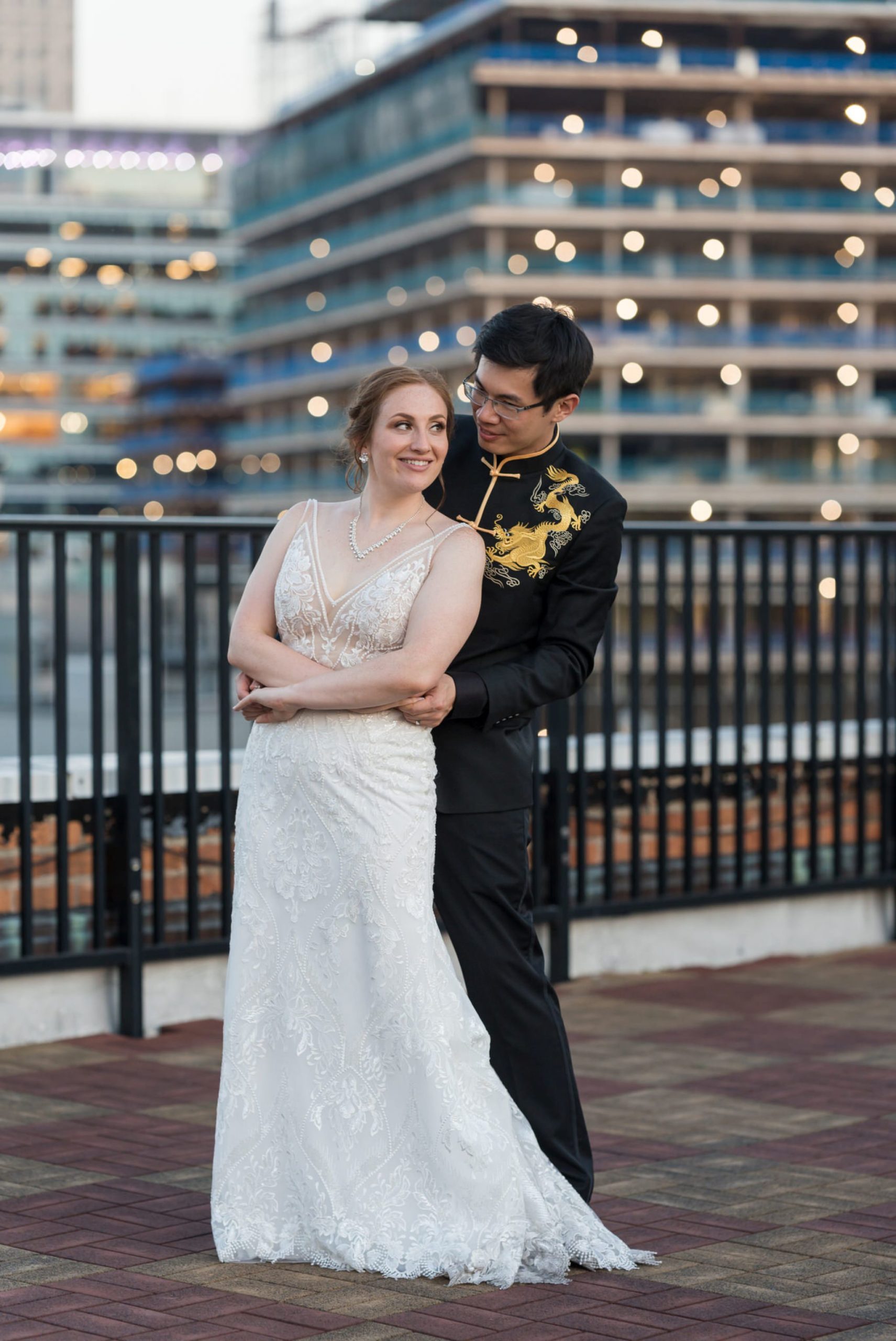 A bride and groom slow dance at their rooftop wedding at Detroit Opera House. 
