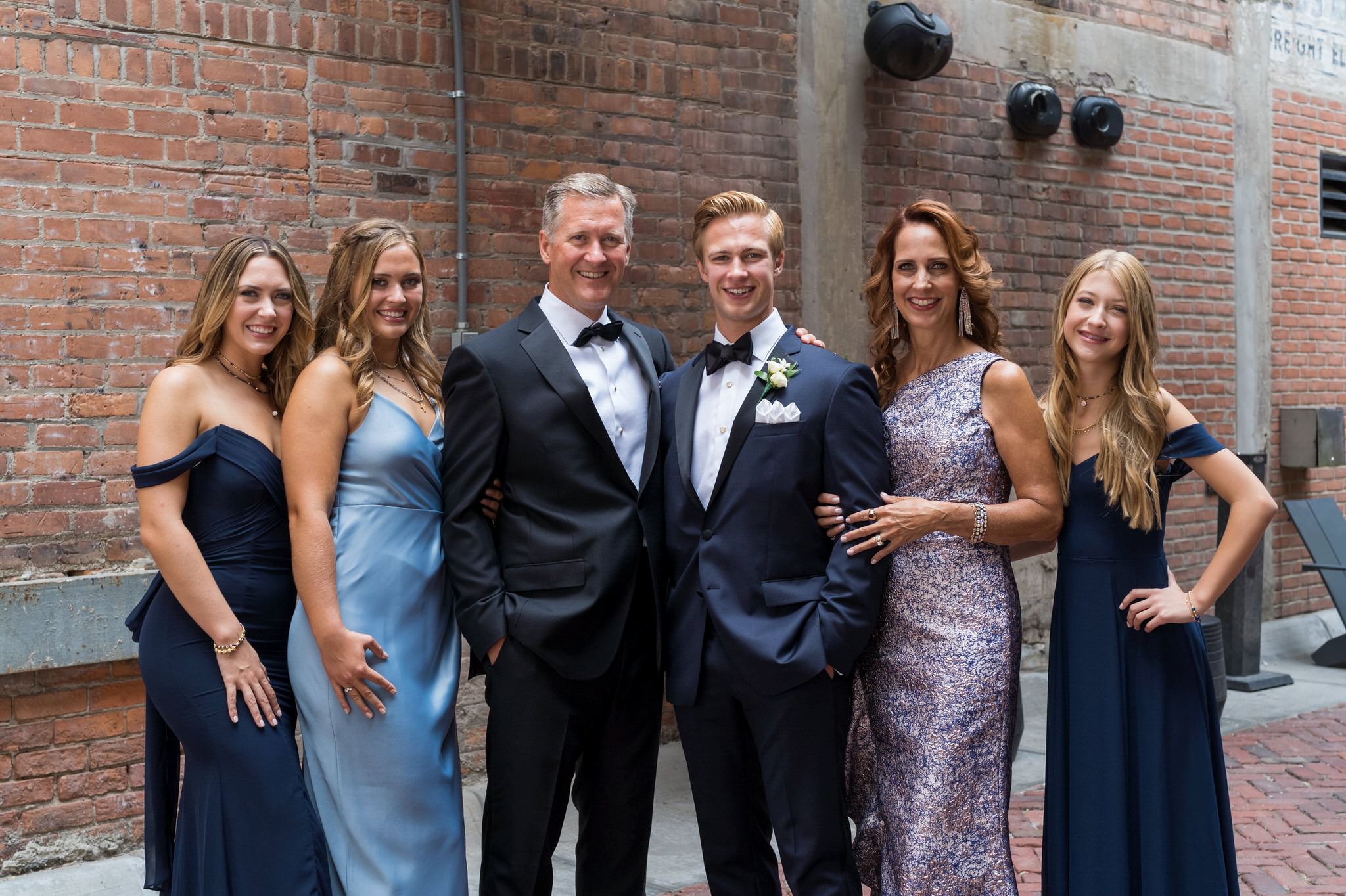 A family photo taken on a wedding day in Parker's Alley Detroit.  