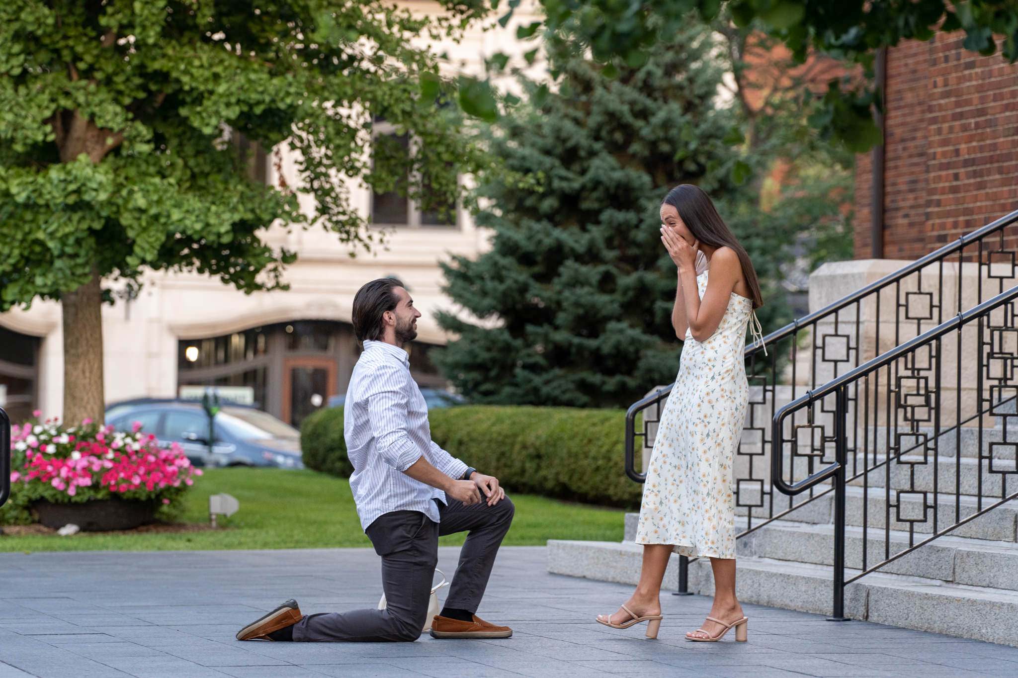 man takes a knee and proposes in a downtown Birmingham proposal 
