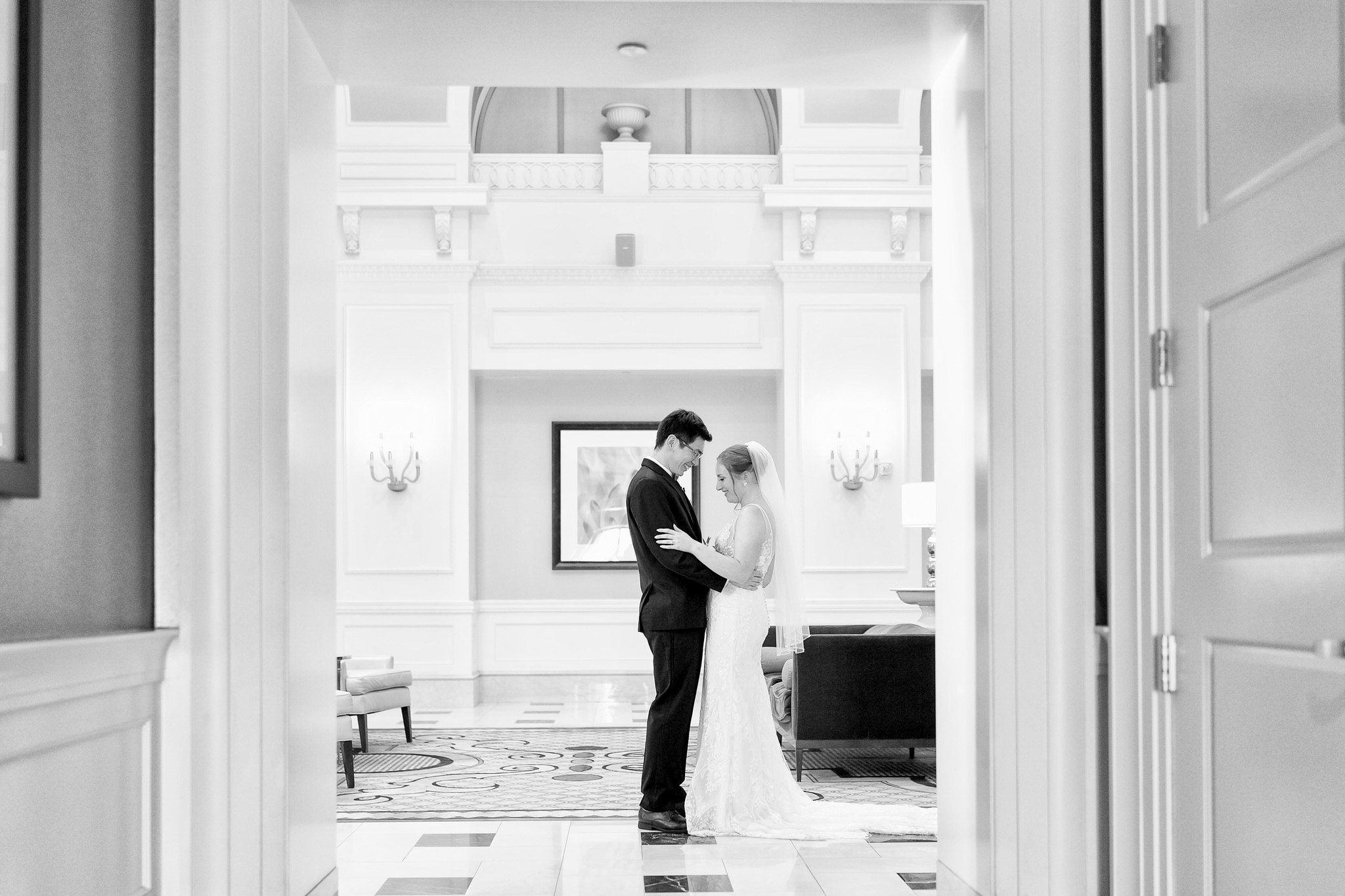 A bride and groom share a first look in the Venetian Room at the Westin Book Cadillac. 