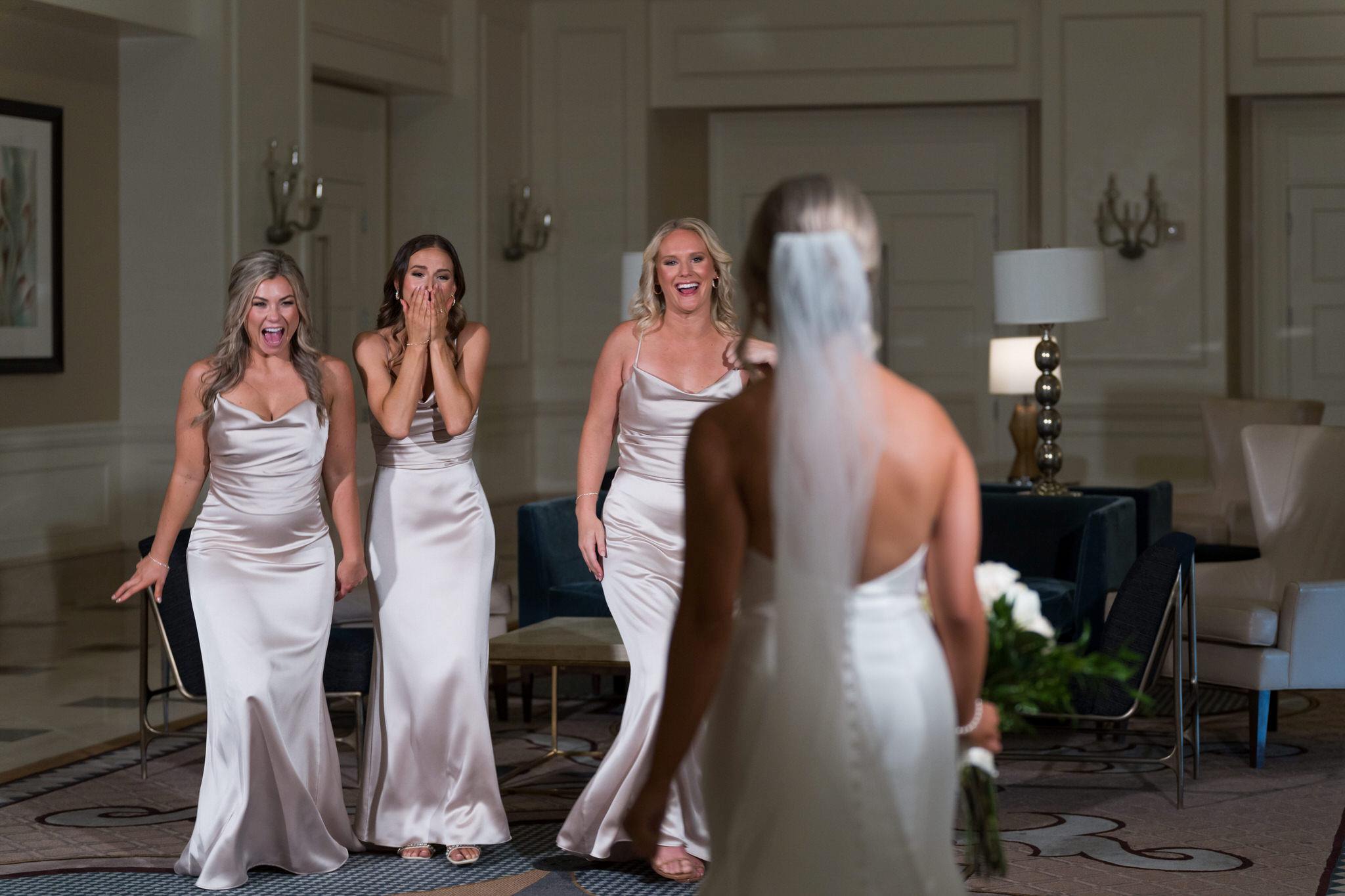 Bridesmaids react to seeing the bride at the Venetian Room in the Westin Book Cadillac.  