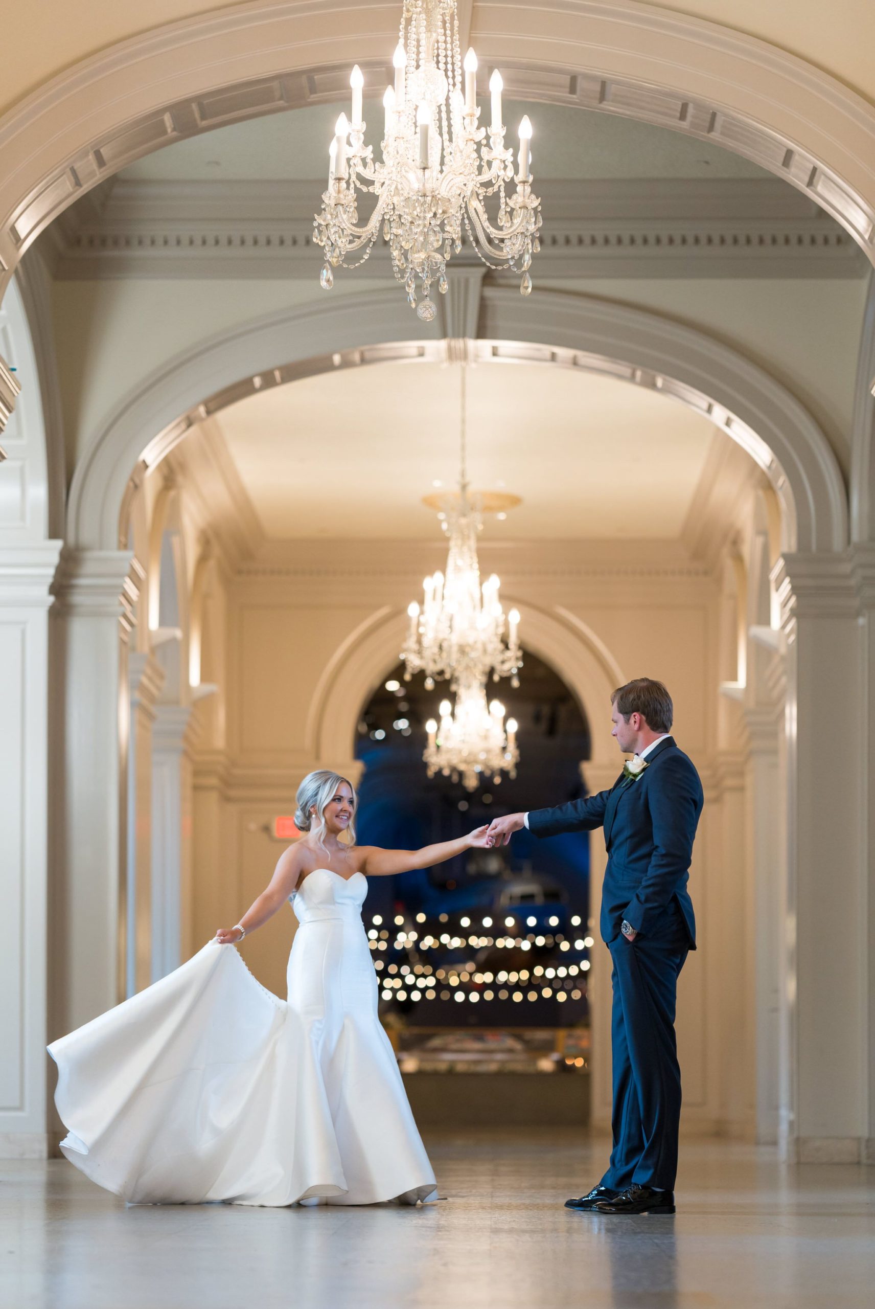 A bride and groom dance in the hallway at a Henry Ford Museum wedding. 