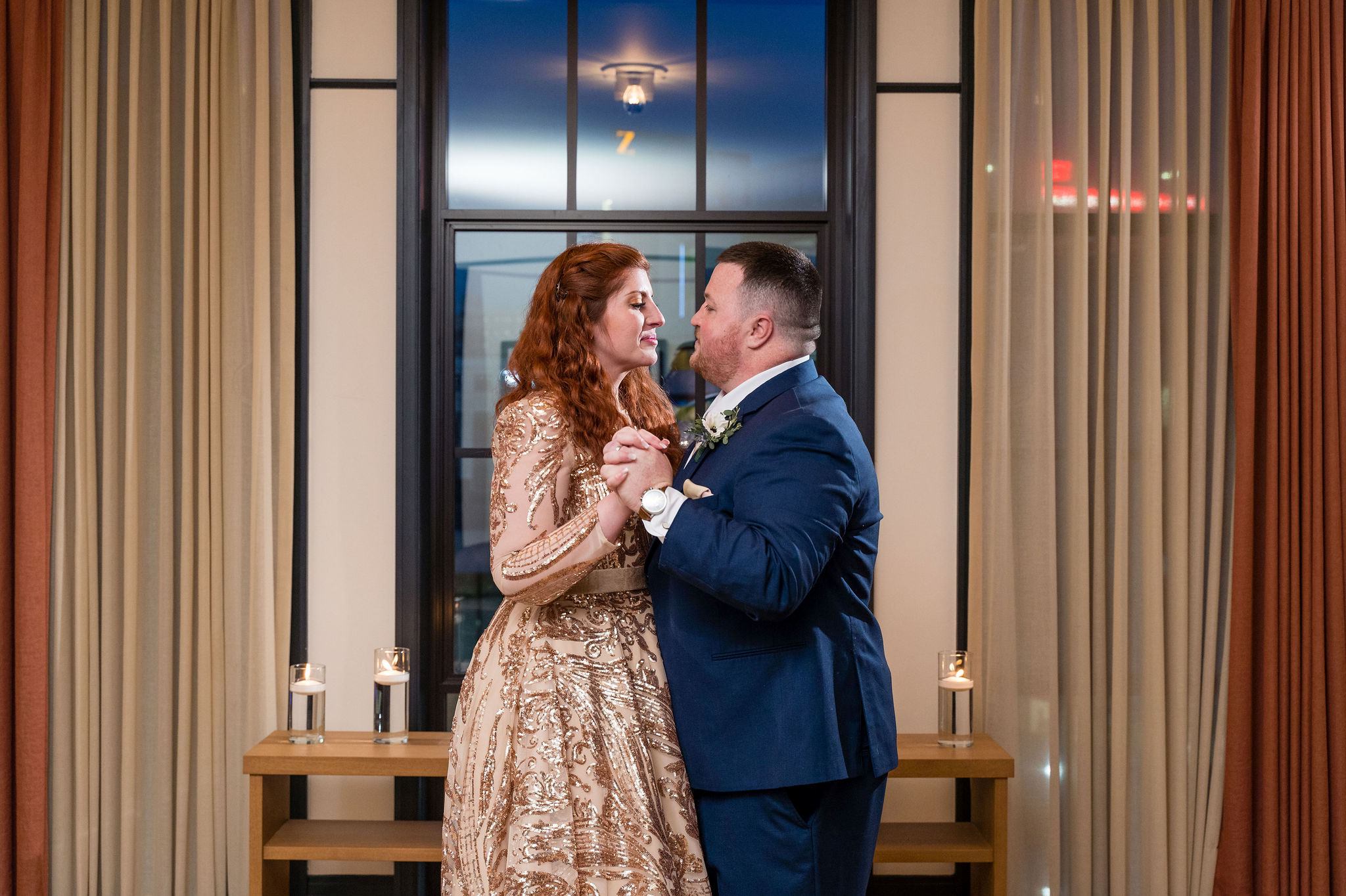 A couple slow dances to celebrate their secret Detroit elopement in a room at the Shinola Hotel. 