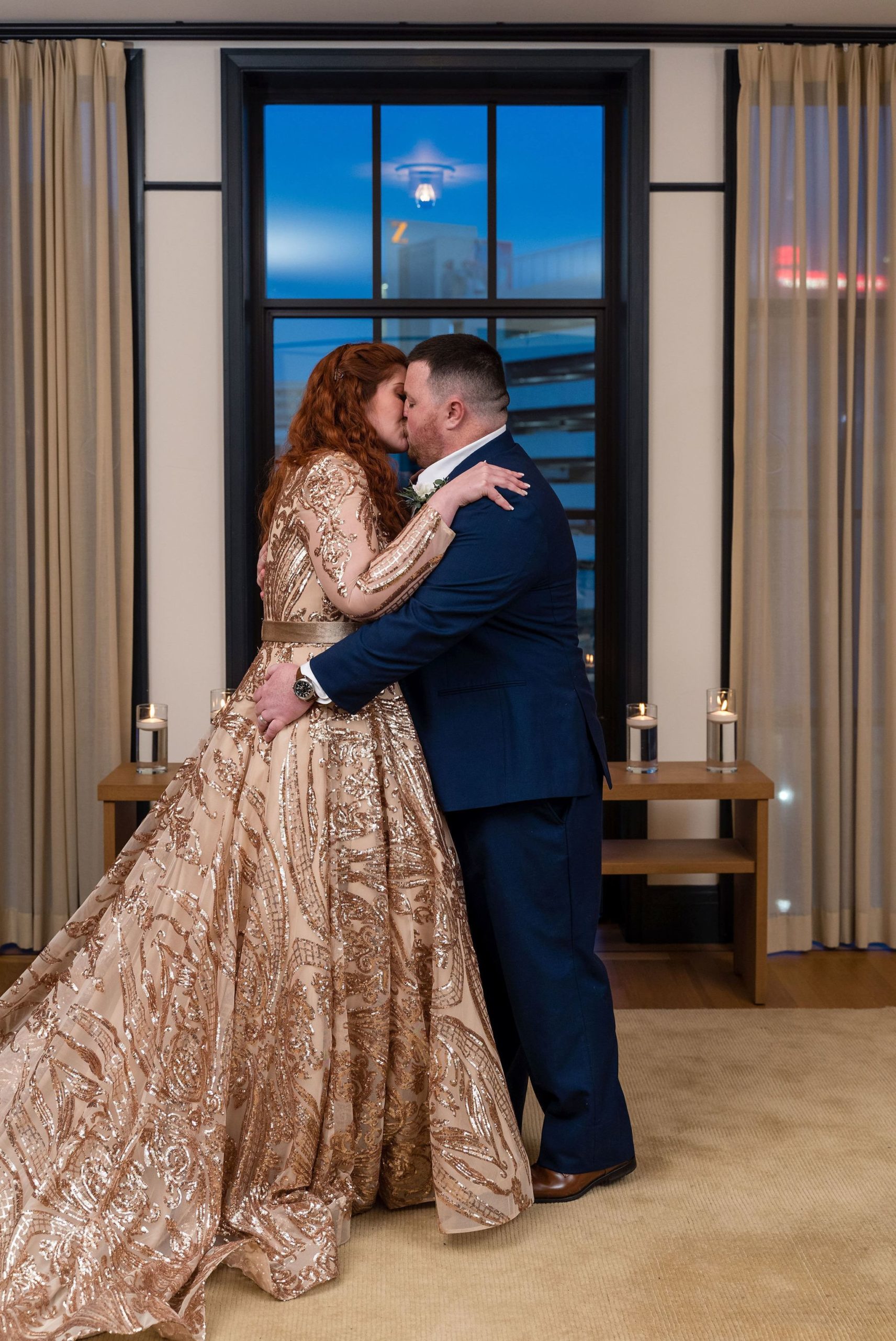 A couple marries and kisses in a secret Detroit elopement in a room at the Shinola Hotel. 