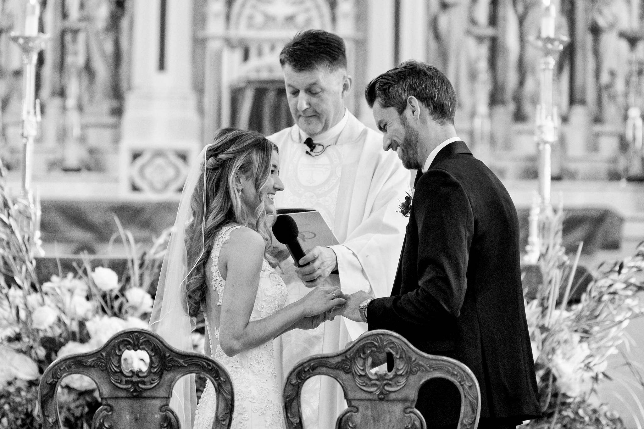 A vow exchange at St. Anne de Detroit wedding.  