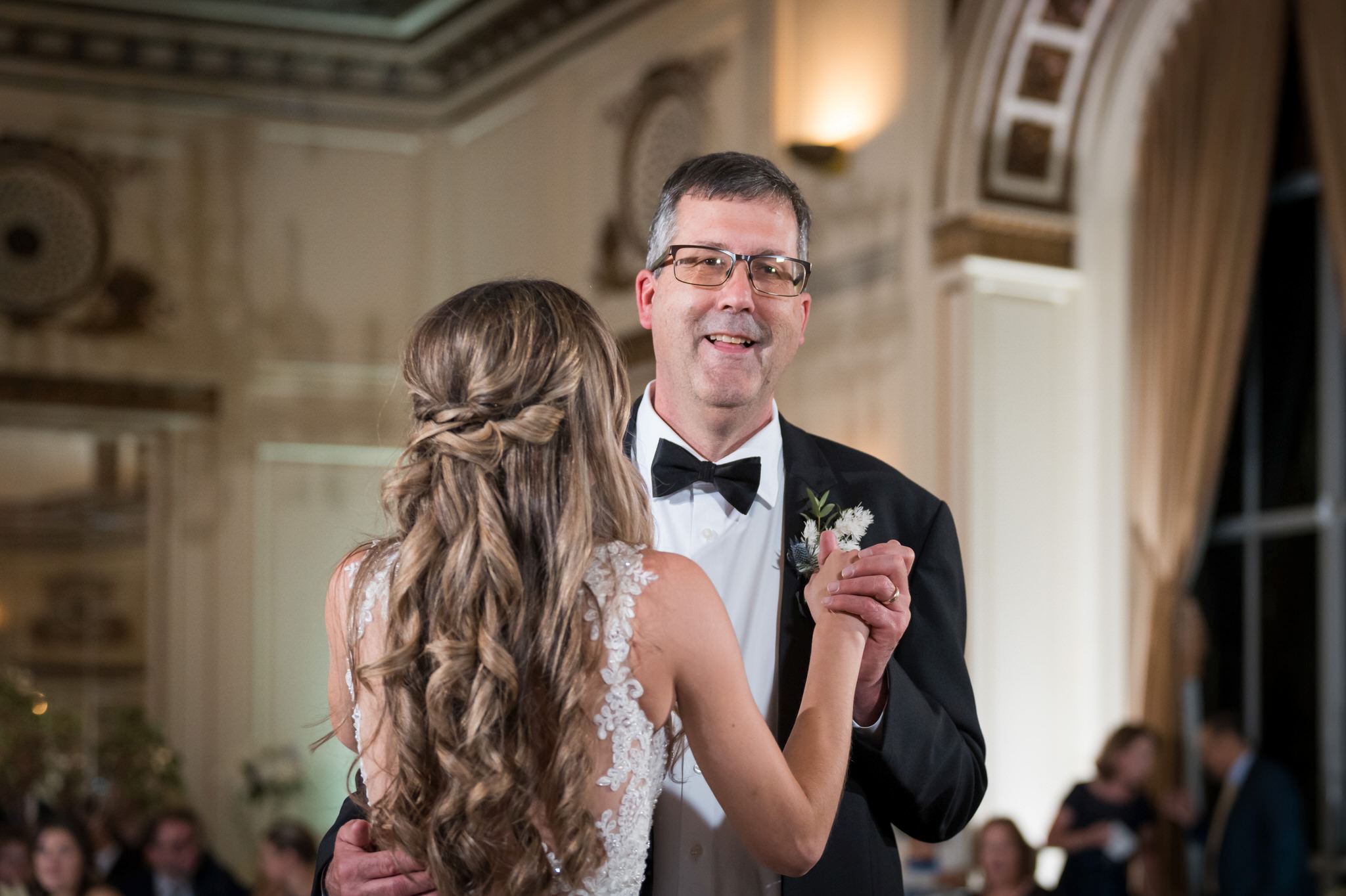 The father of the bride dances with his daughter at a wedding at Detroit's Colony Club.