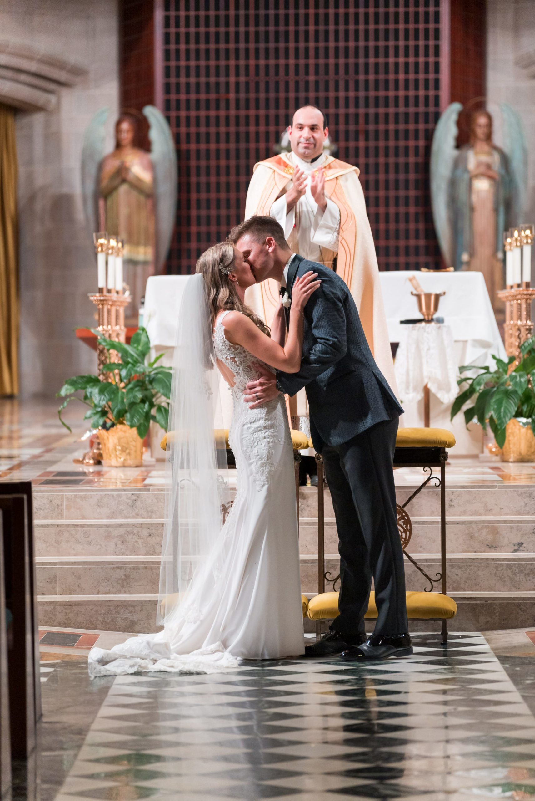 A couple kisses as they are announced husband and wife at the Cathedral of the Most Blessed Sacrament church in Detroit, MI.