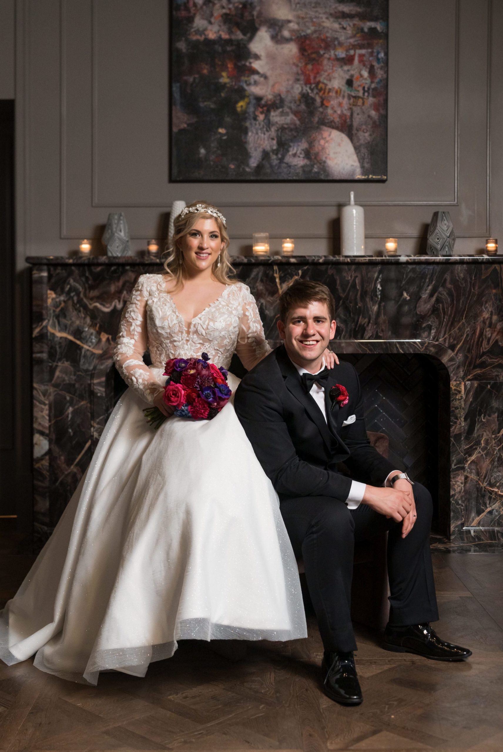 A bride and groom pose in formal fashion at their Daxton Hotel wedding.  