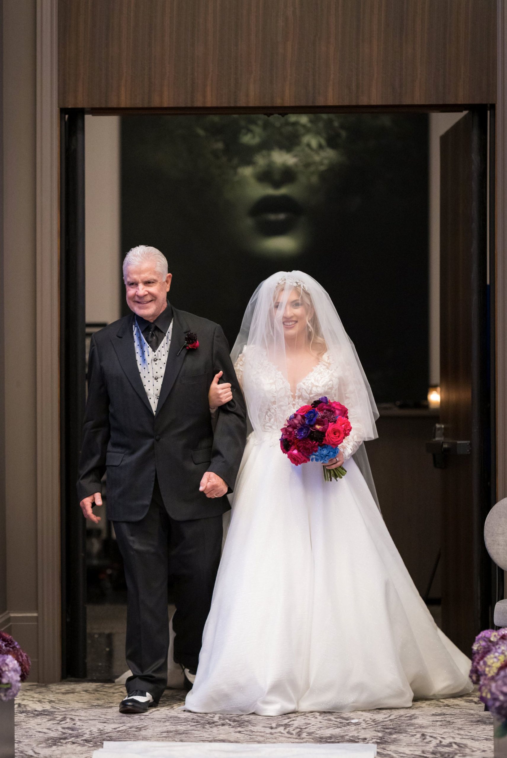 A bride enters the ballroom of her Daxton Hotel wedding.  