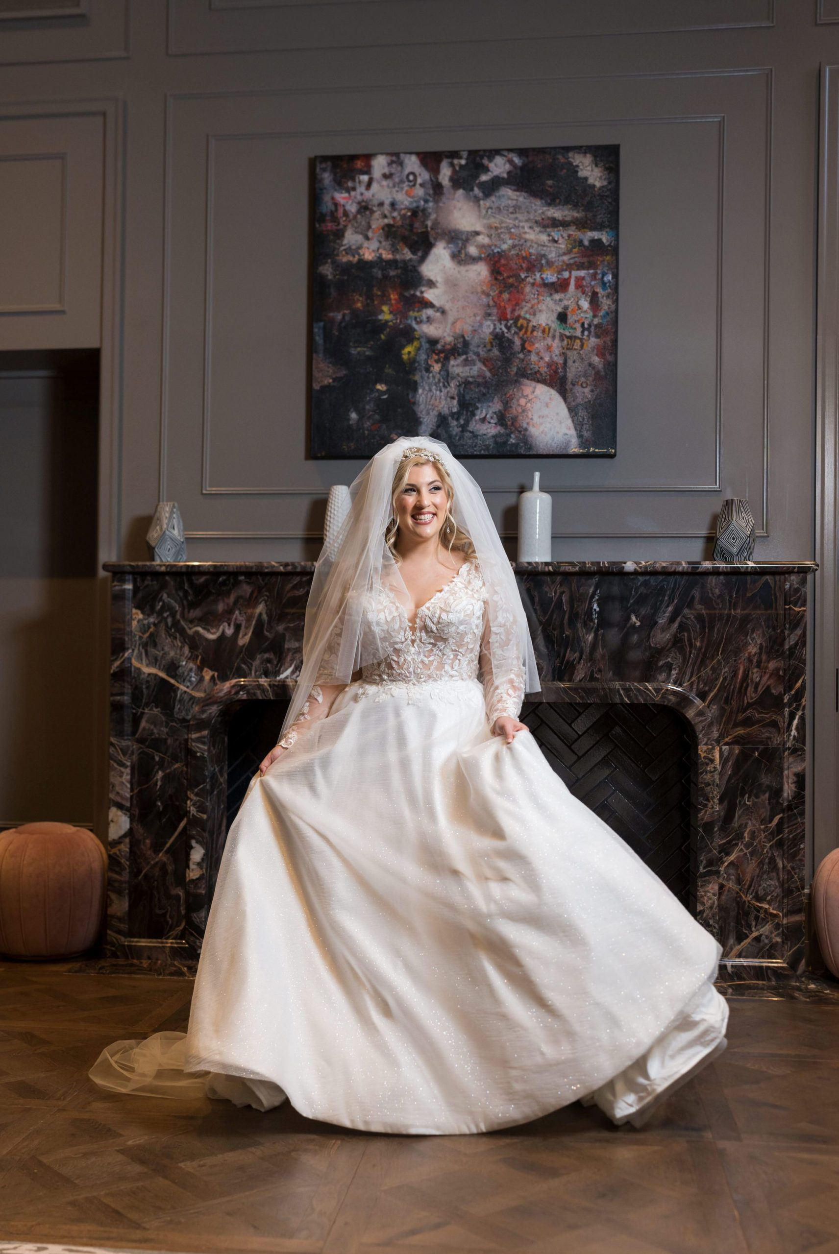 A bride poses on her wedding day at the Daxton Hotel in Birmingham, MI.  